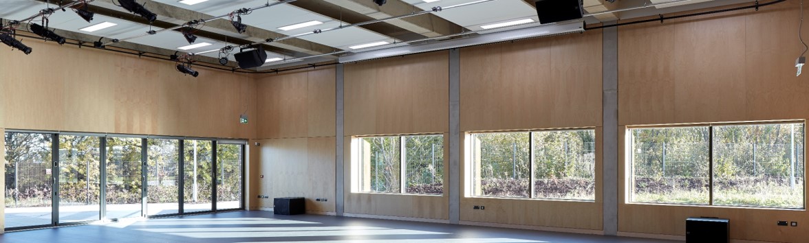 Spacious event space with natural light, ideal for workshops and presentations.