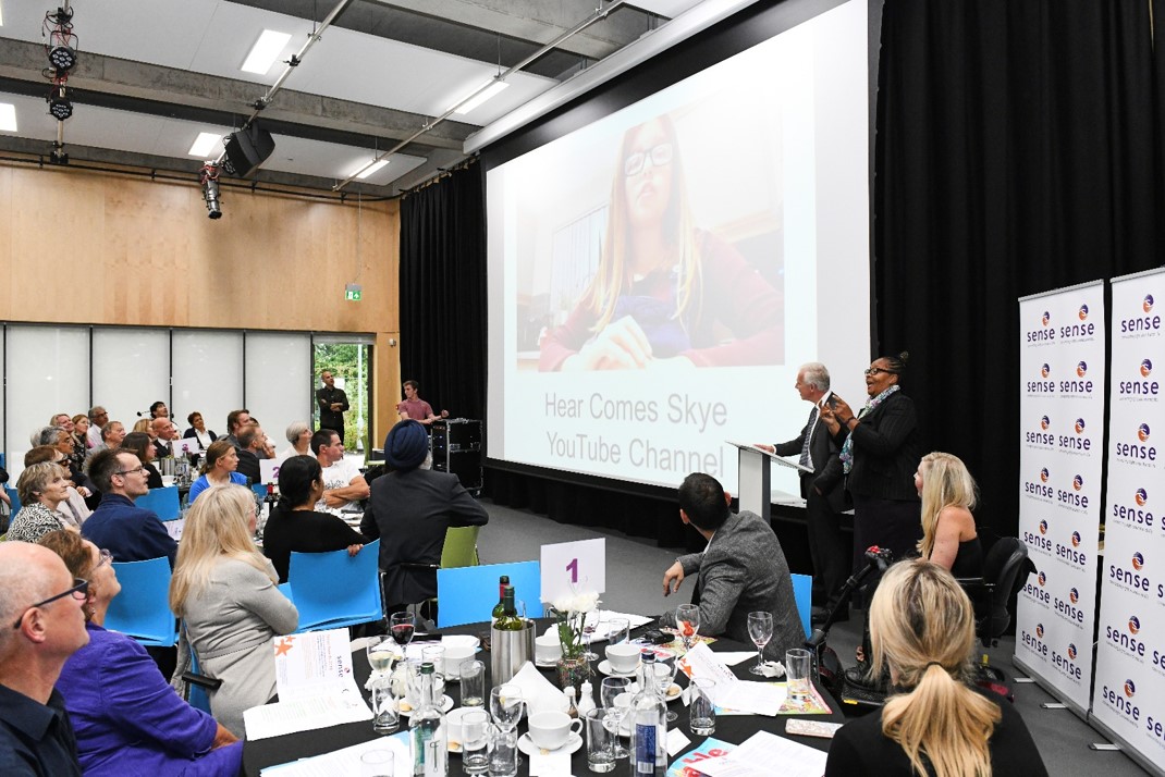 Dynamic speaker event at TouchBase Pears with audience engagement and professional setup.