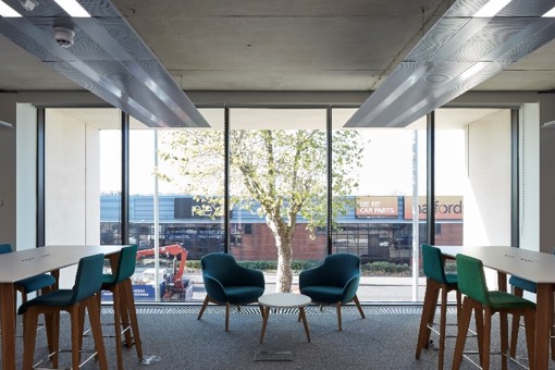 Modern meeting room with casual seating for networking and brainstorming events.
