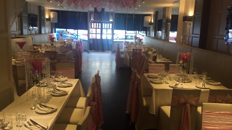 Elegant event space at Orama Restaurant with white linens, ideal for weddings and celebrations.
