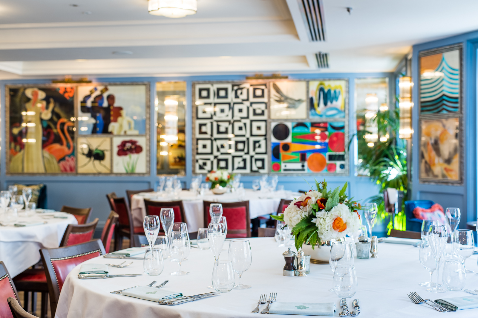 Elegant dining area in The Baldwin Room, ideal for events with floral centerpieces.