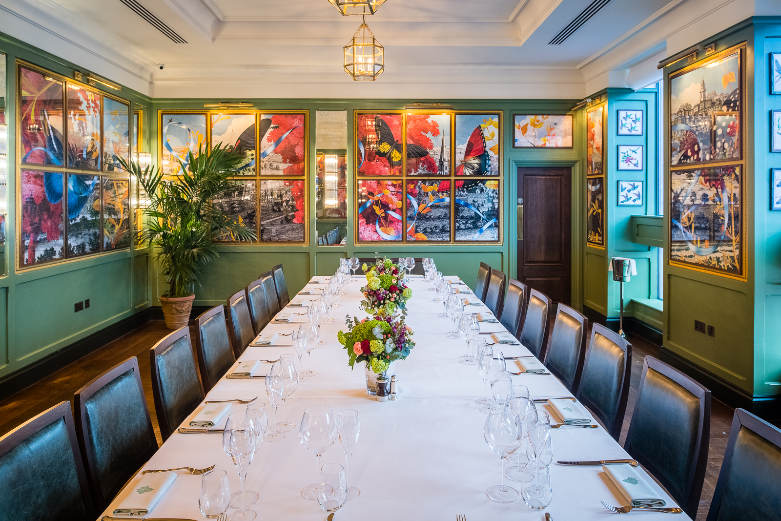 The Archer Room at The Ivy Temple Row, elegant meeting space with vibrant artwork.