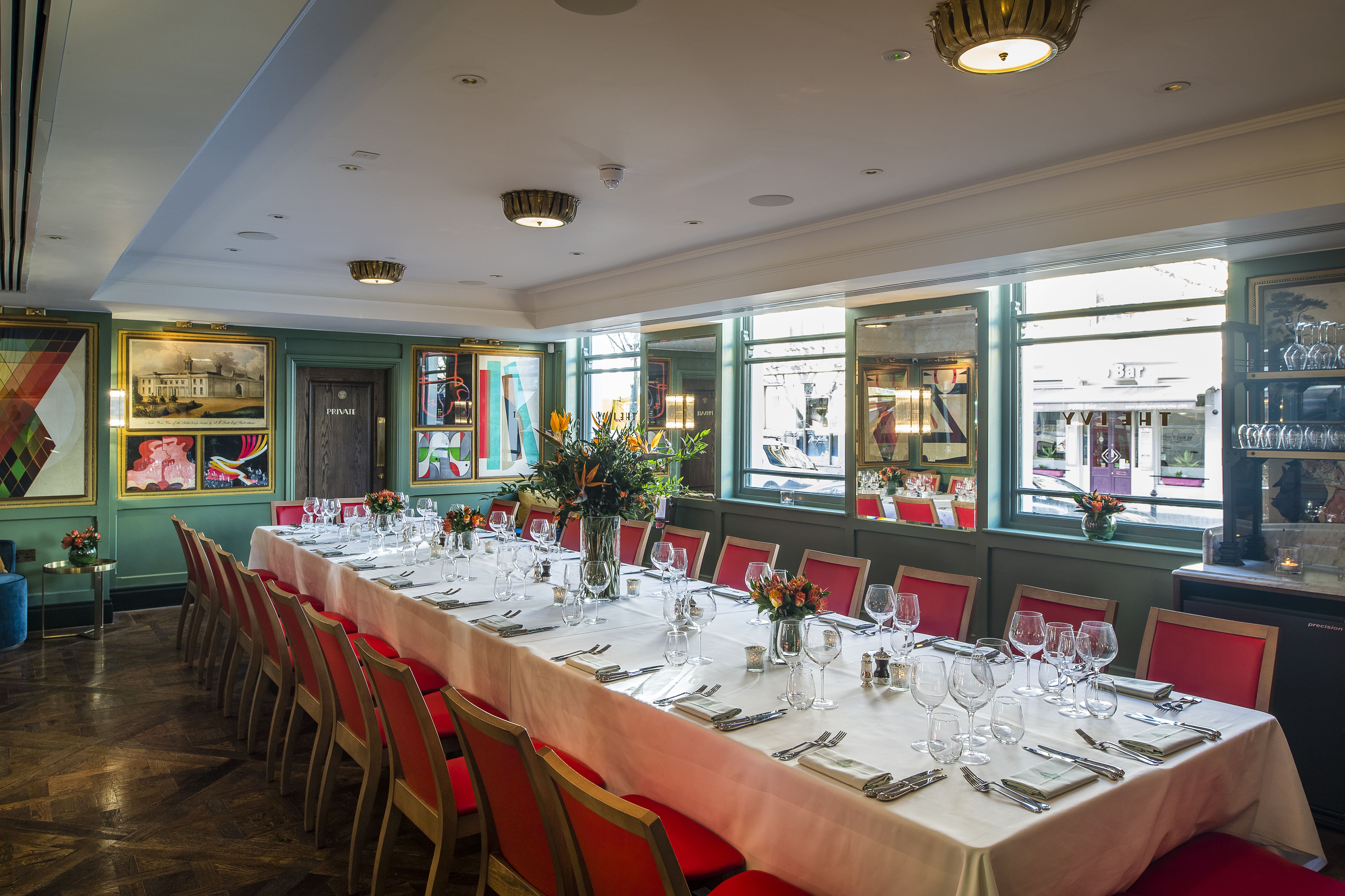 Elegant dining setup in The Papworth Room for corporate dinners or intimate gatherings.
