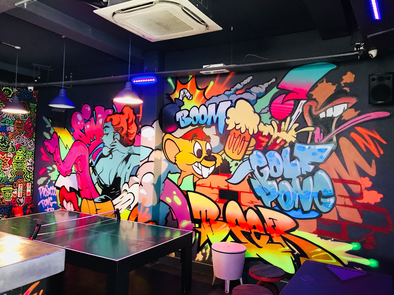 Vibrant mural at Main Bar, Shoreditch, ideal for casual meetings and team-building events.