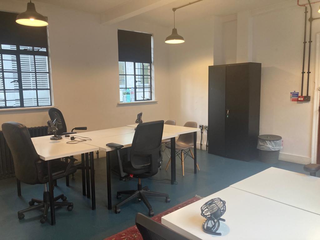 Minimalist meeting room at 2Northdown, King's Cross with ergonomic chairs for events.