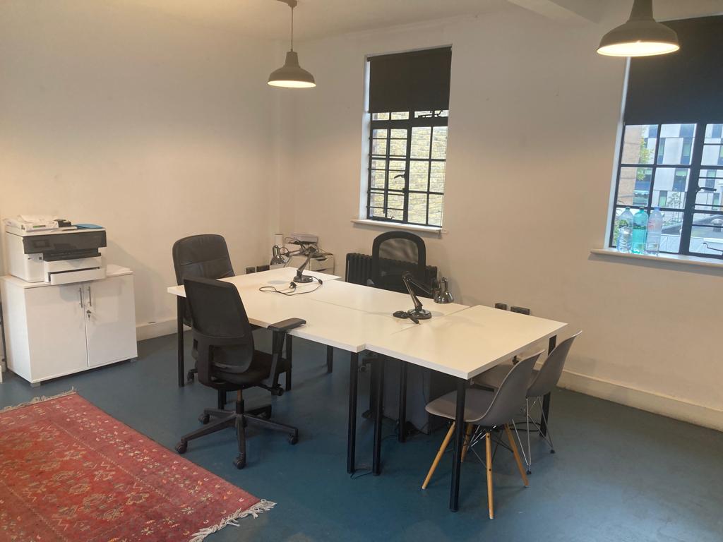 Modern meeting room at 2Northdown, King's Cross with ergonomic chairs and natural light.