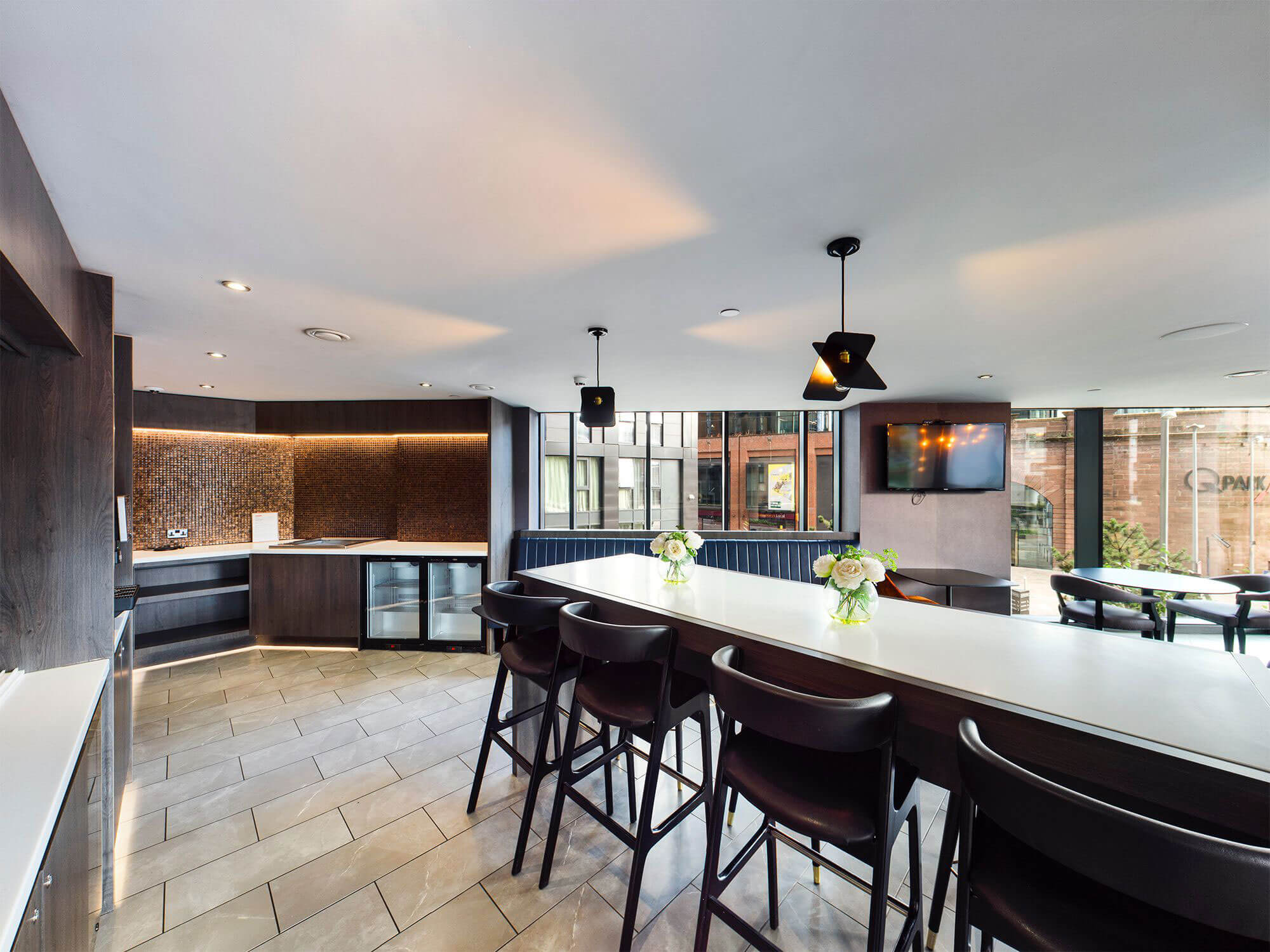 Modern kitchen and dining area in Embankment Lounge, ideal for events and networking.