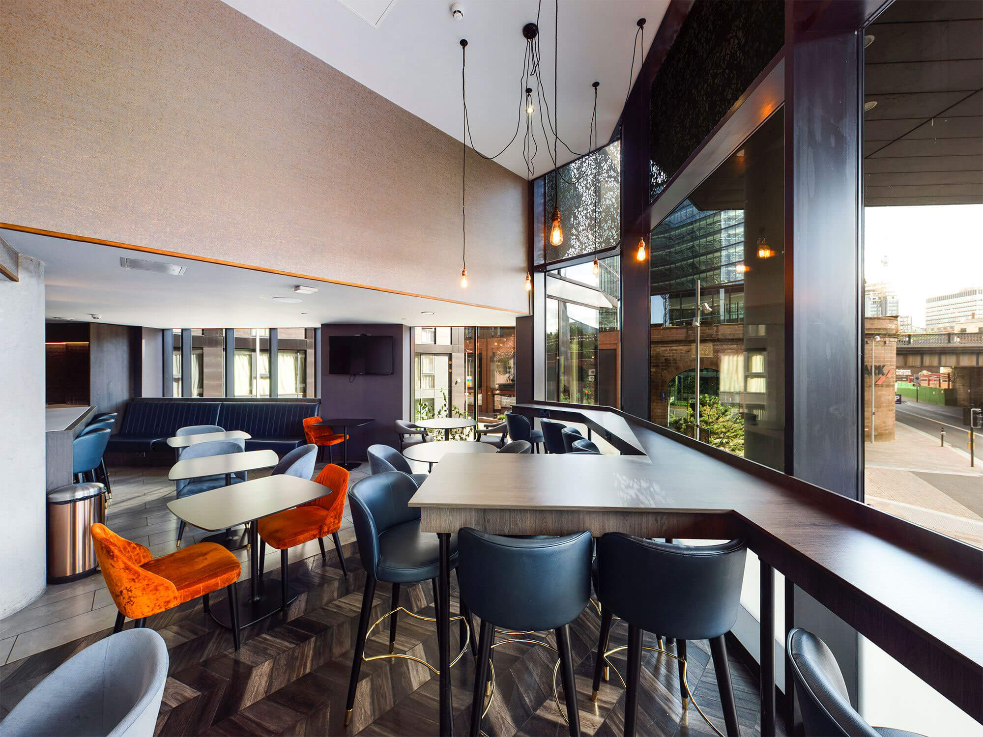 Modern Embankment Lounge with large windows, perfect for networking events and meetings.