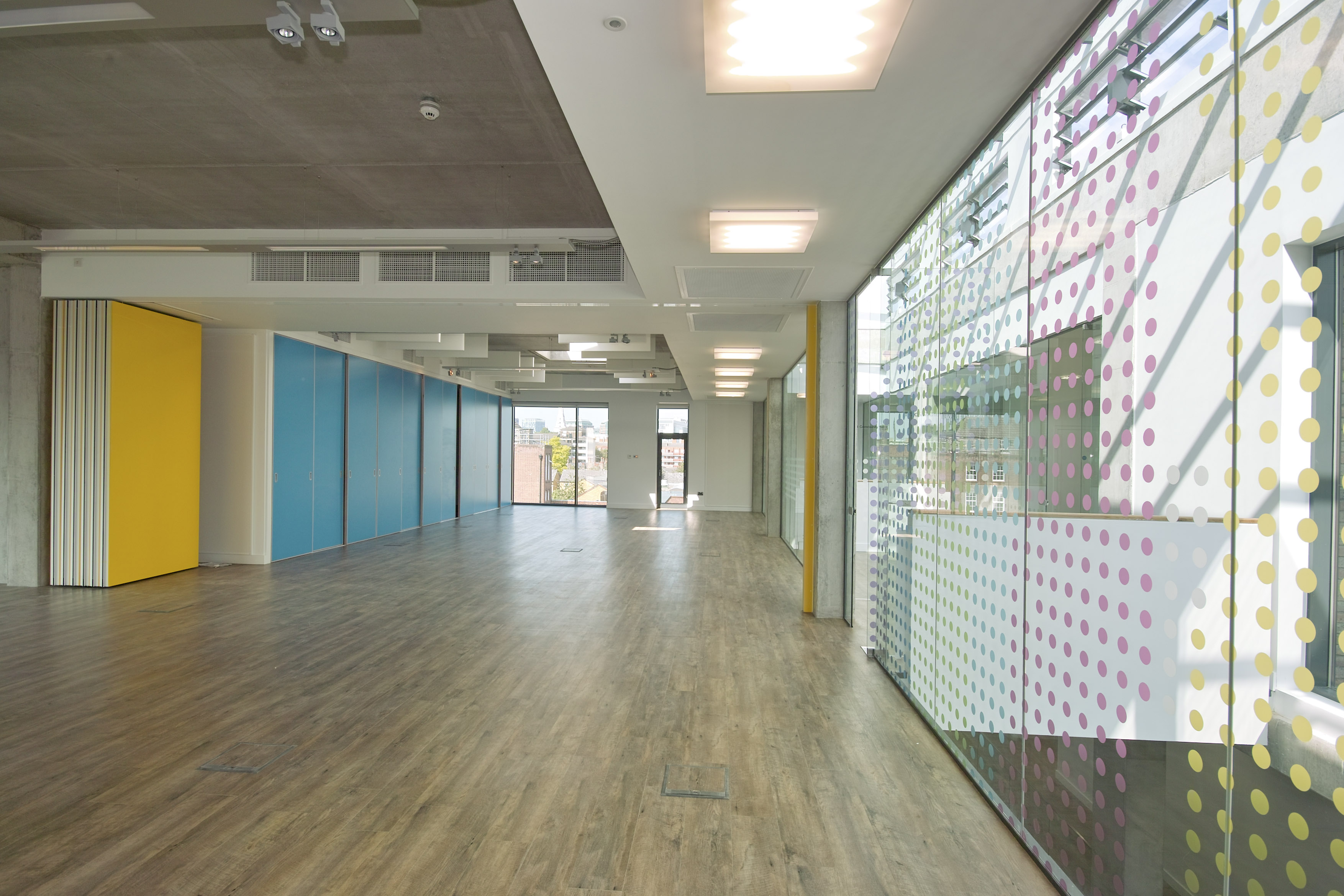 Modern Community Hall in Osmani Trust, featuring large windows for events and gatherings.