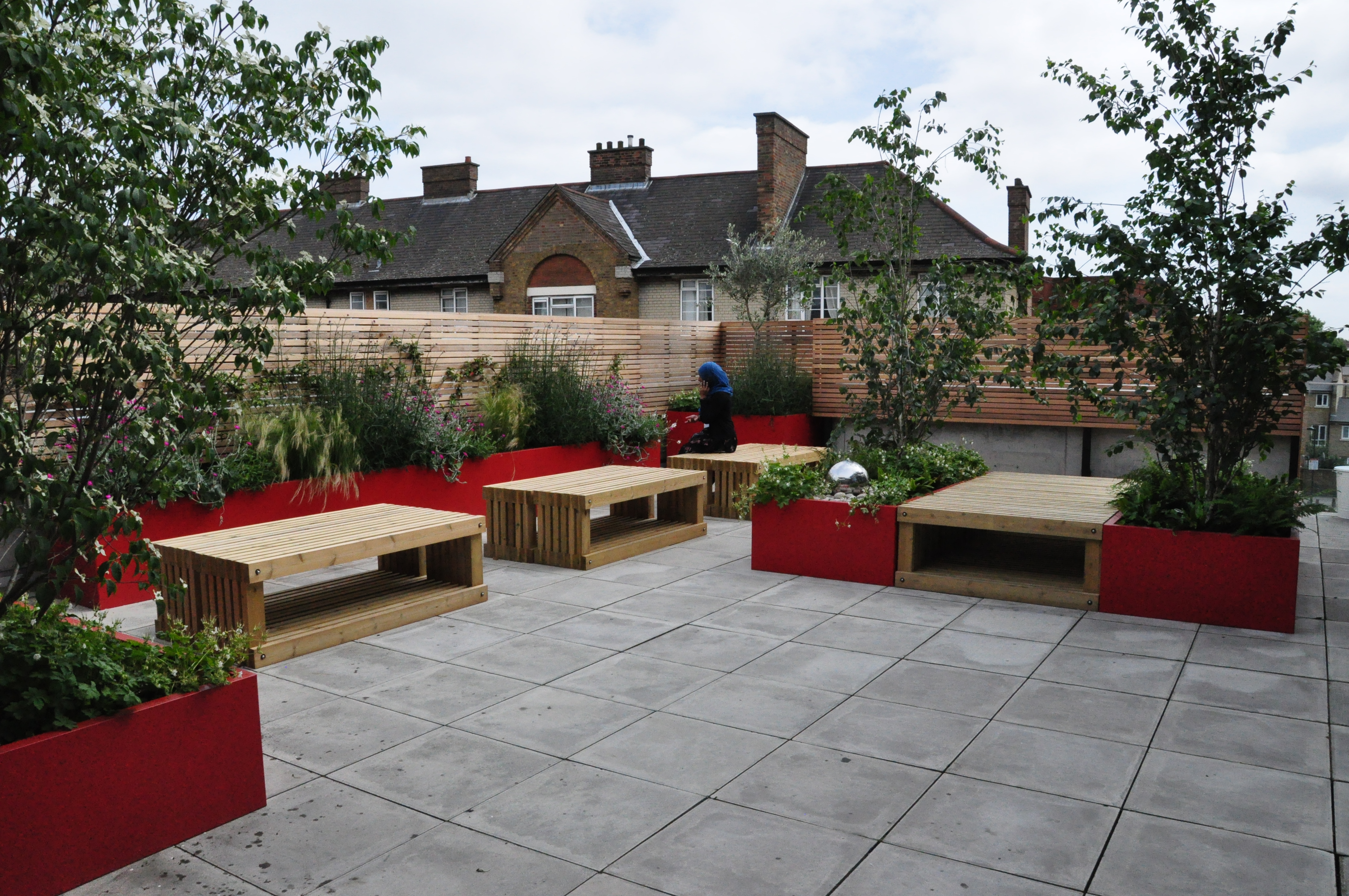 Outdoor Community Hall at Osmani Trust with modern seating for networking events.