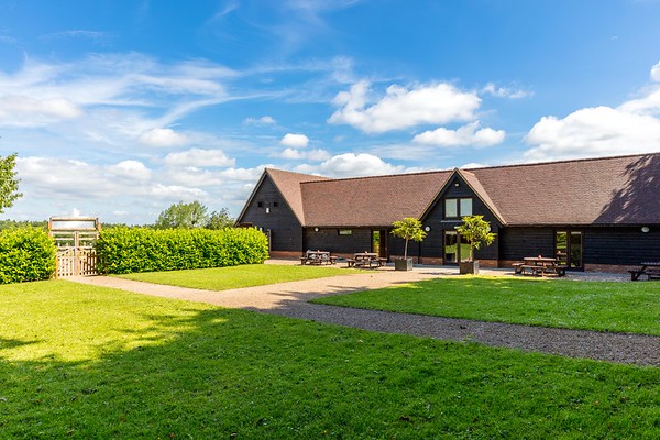 Cobbold Barn at Knebworth House: spacious outdoor venue for events and meetings.