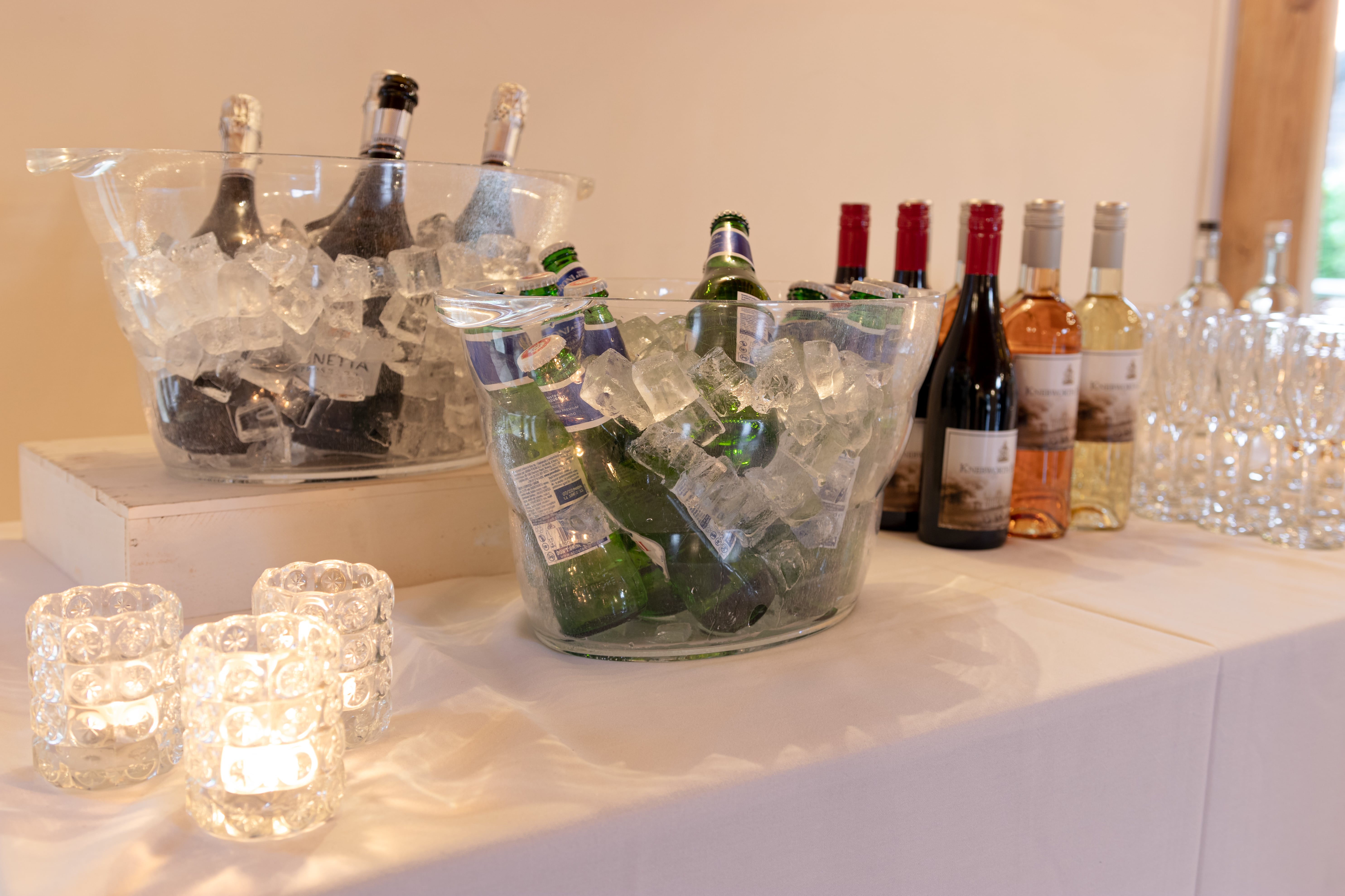 Cobbold Barn beverage station with wines, beers, and elegant glassware for events.