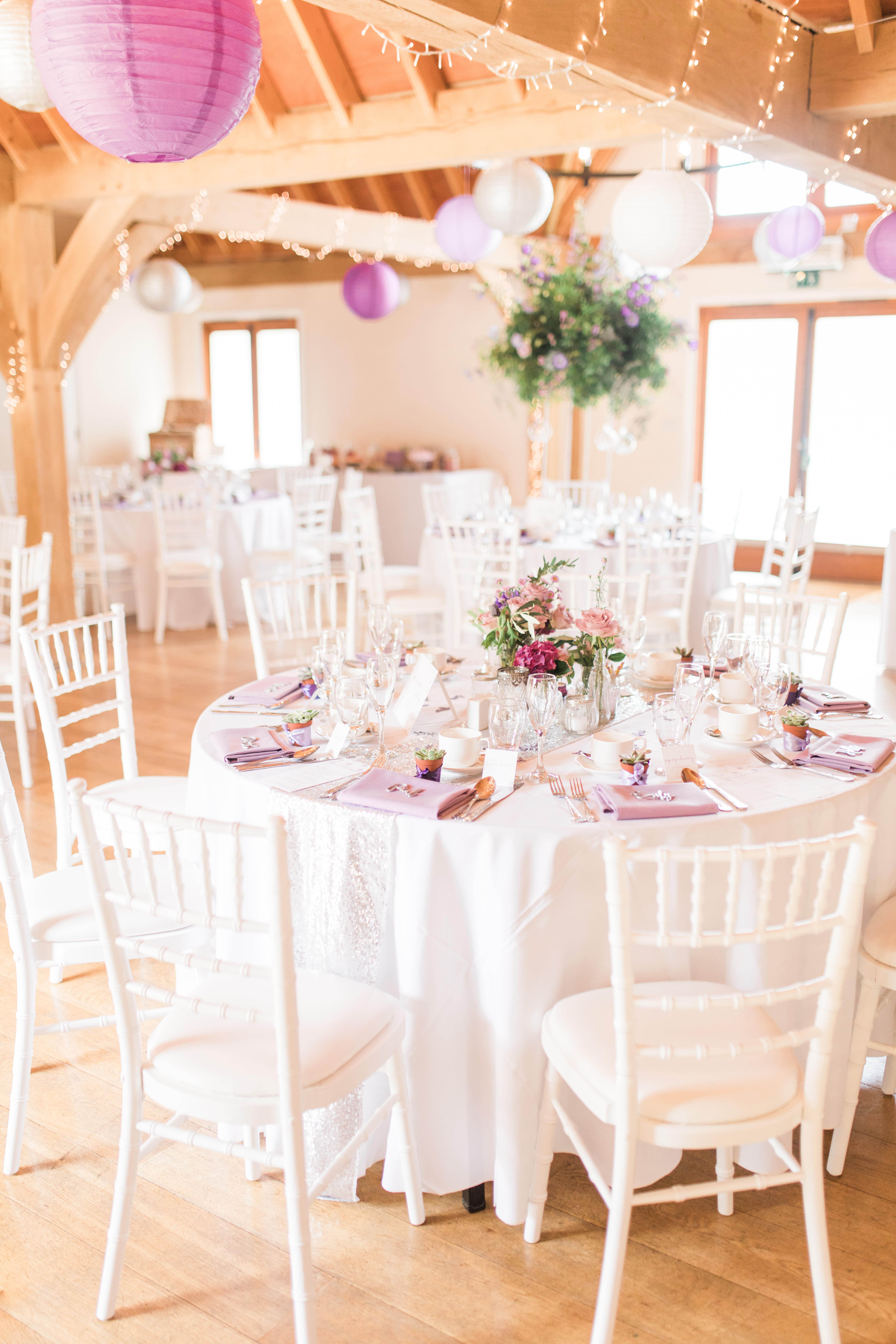Cobbold Barn event space with elegant tables, perfect for weddings and upscale gatherings.