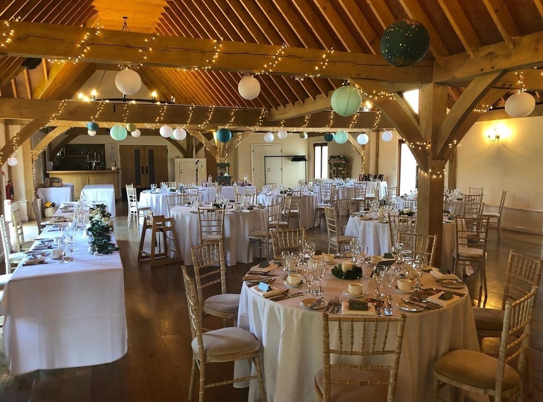 Cobbold Barn at Knebworth House, elegant wedding venue with rustic wooden beams.