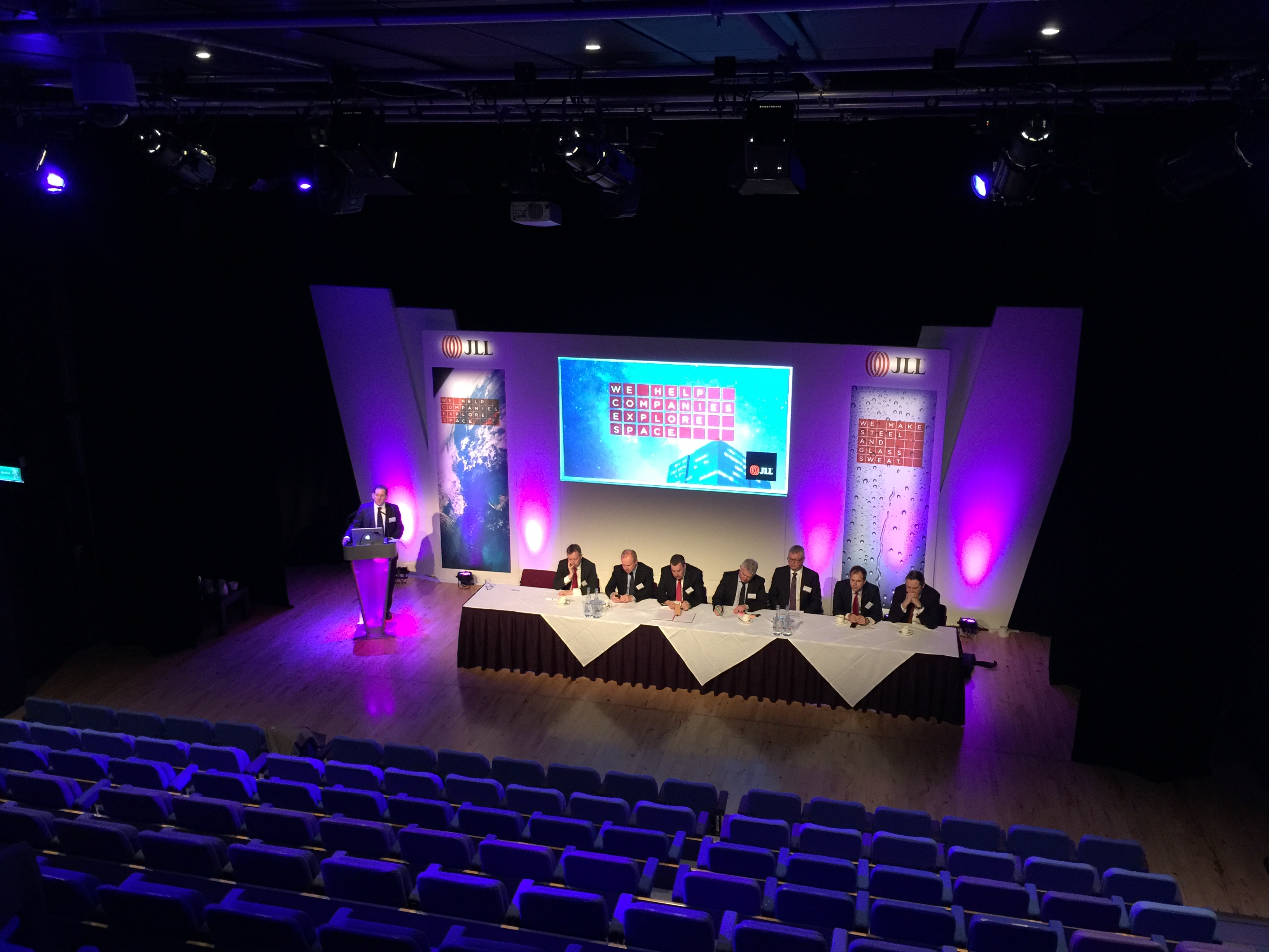 Panel discussion setup at Patrick Studio, Birmingham with engaging backdrop and lighting.