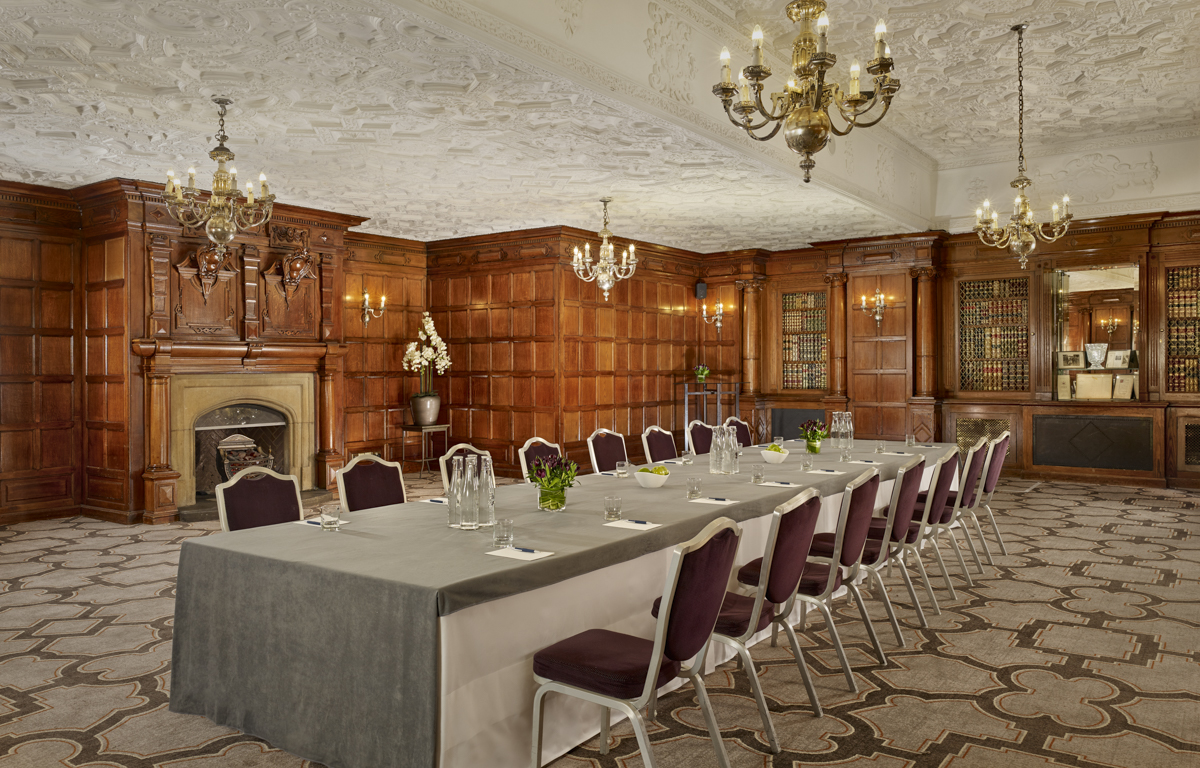 Elegant Oak Room at Sheraton Grand London for corporate events, featuring wood paneling.