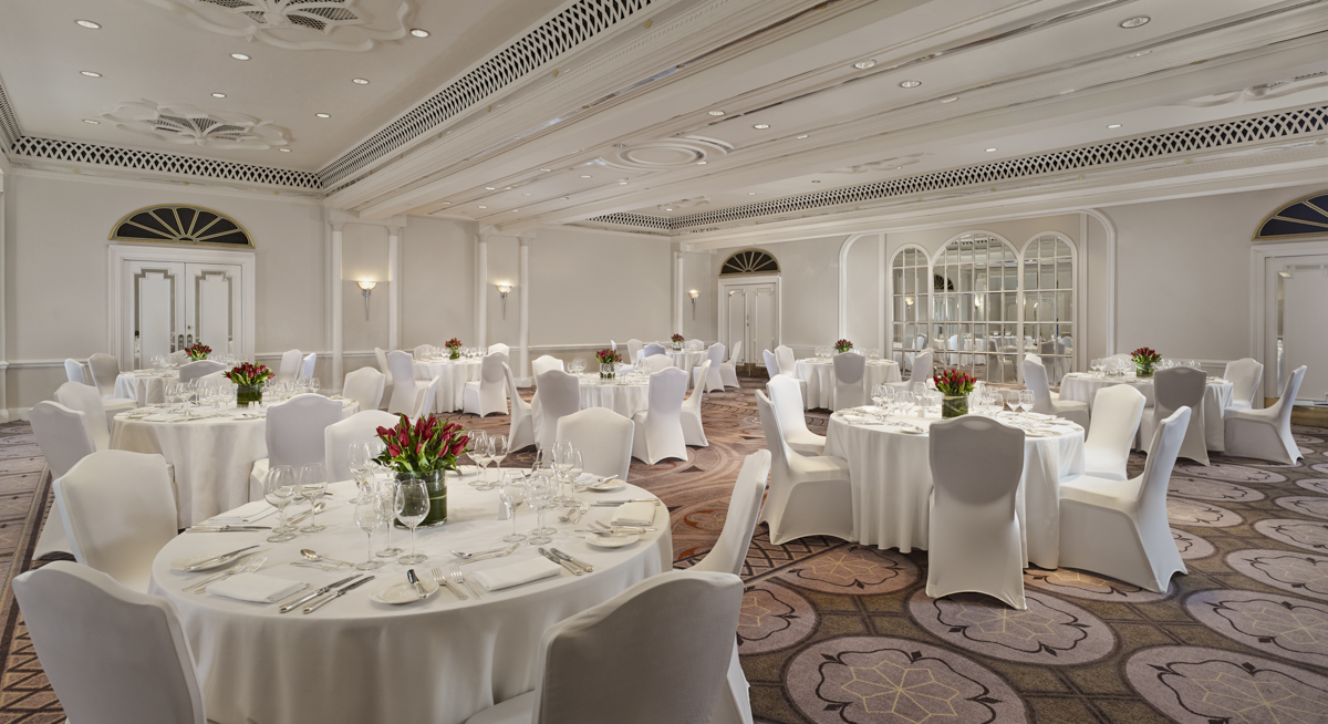 Elegant Tudor Rose event space with white linens, ideal for weddings and corporate events.