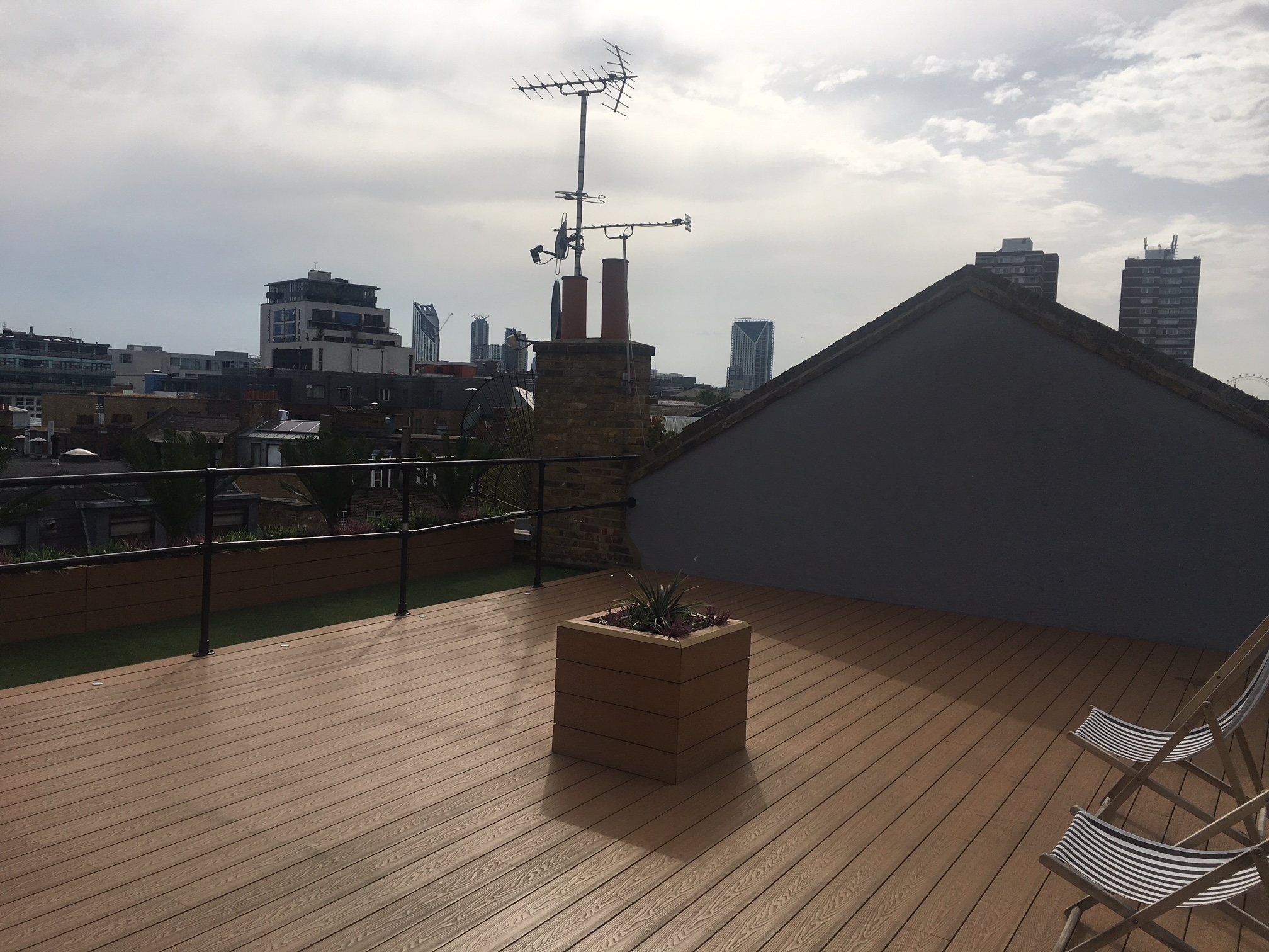 Spacious rooftop terrace with wooden deck for outdoor networking events in Bermondsey.