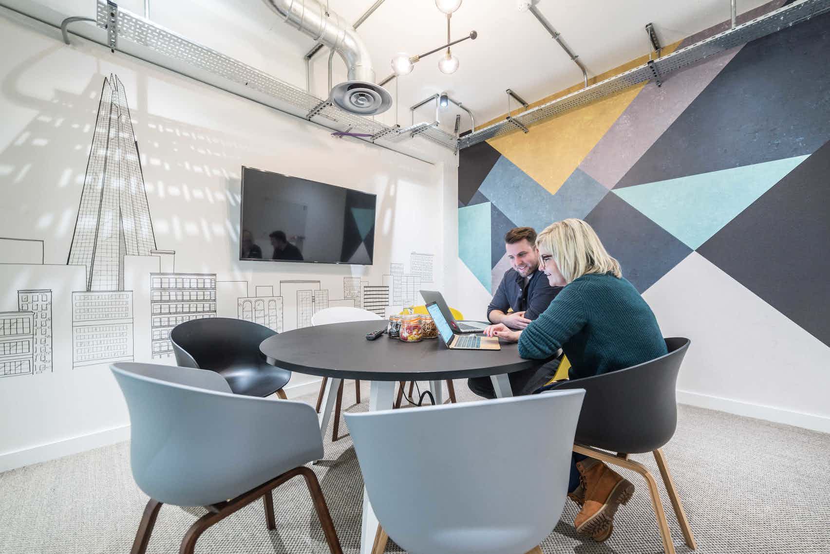 Modern meeting space at The Shard with round table for collaborative brainstorming sessions.