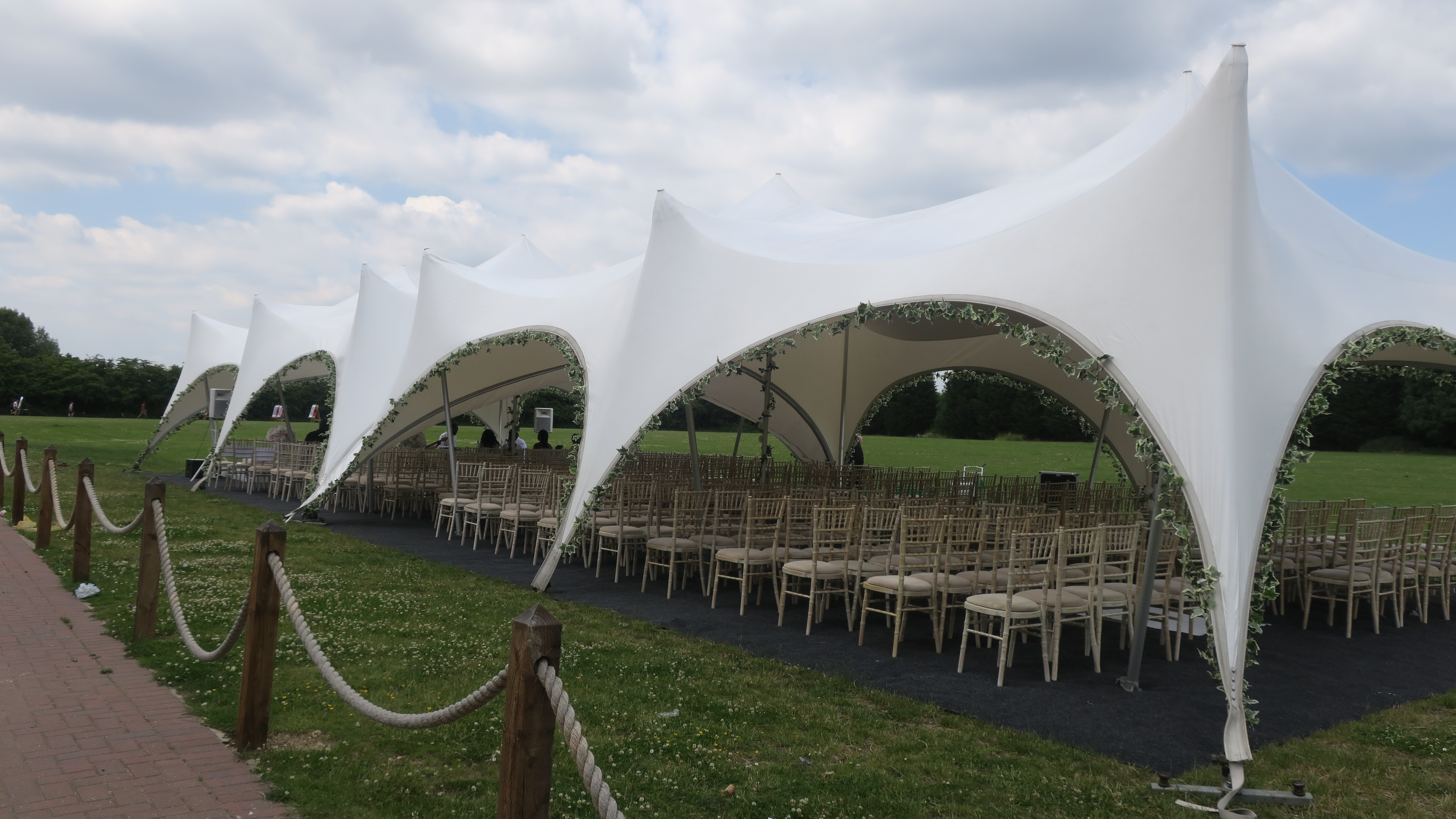 Elegant outdoor event setup in The Willow's Ballroom with spacious tent and seating.