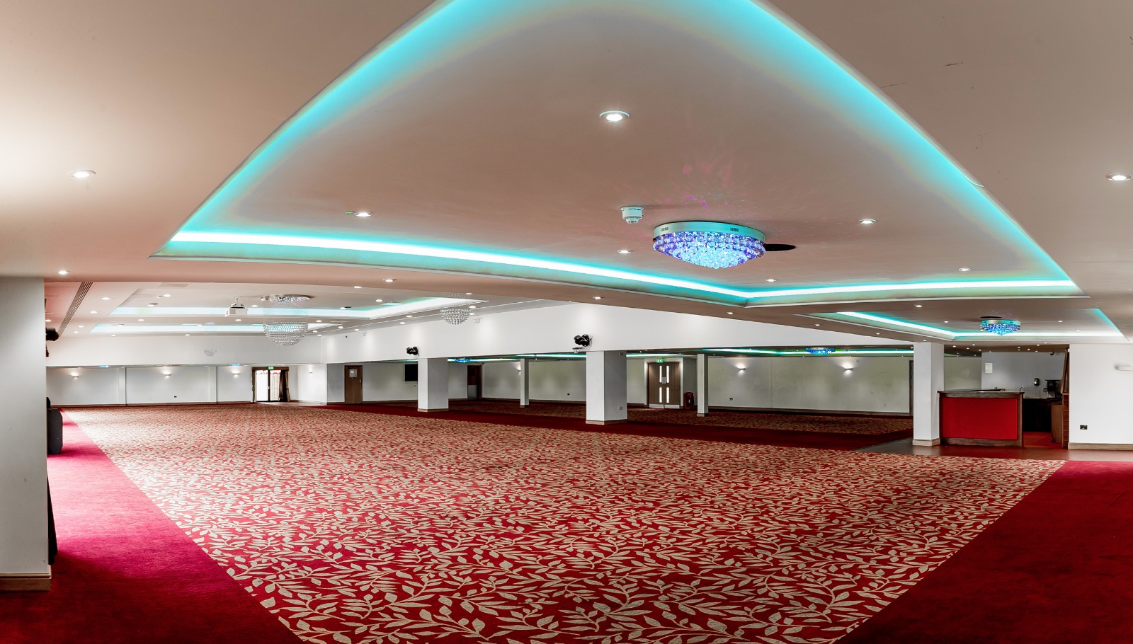 Elegant ballroom venue with modern lighting, perfect for conferences and banquets.