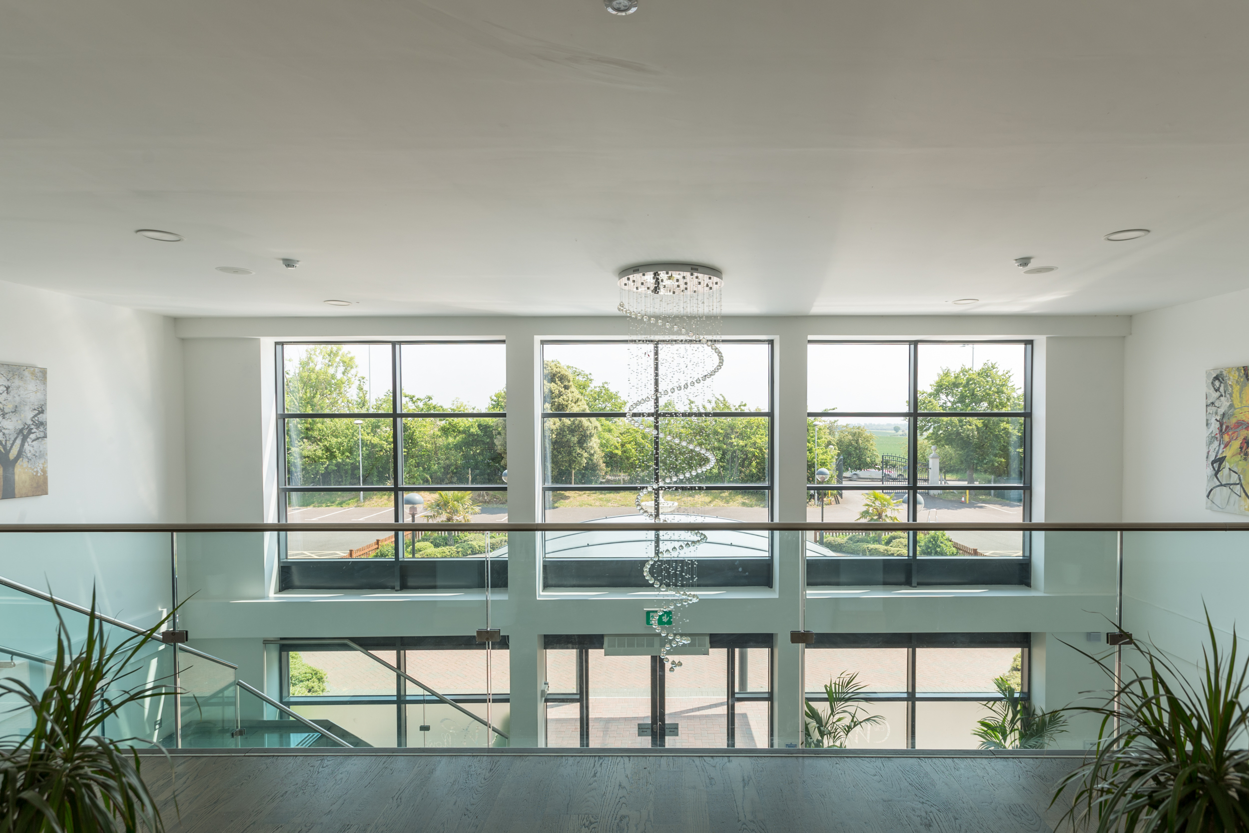 Bright Premier Suite with large windows, ideal for networking events and conferences.