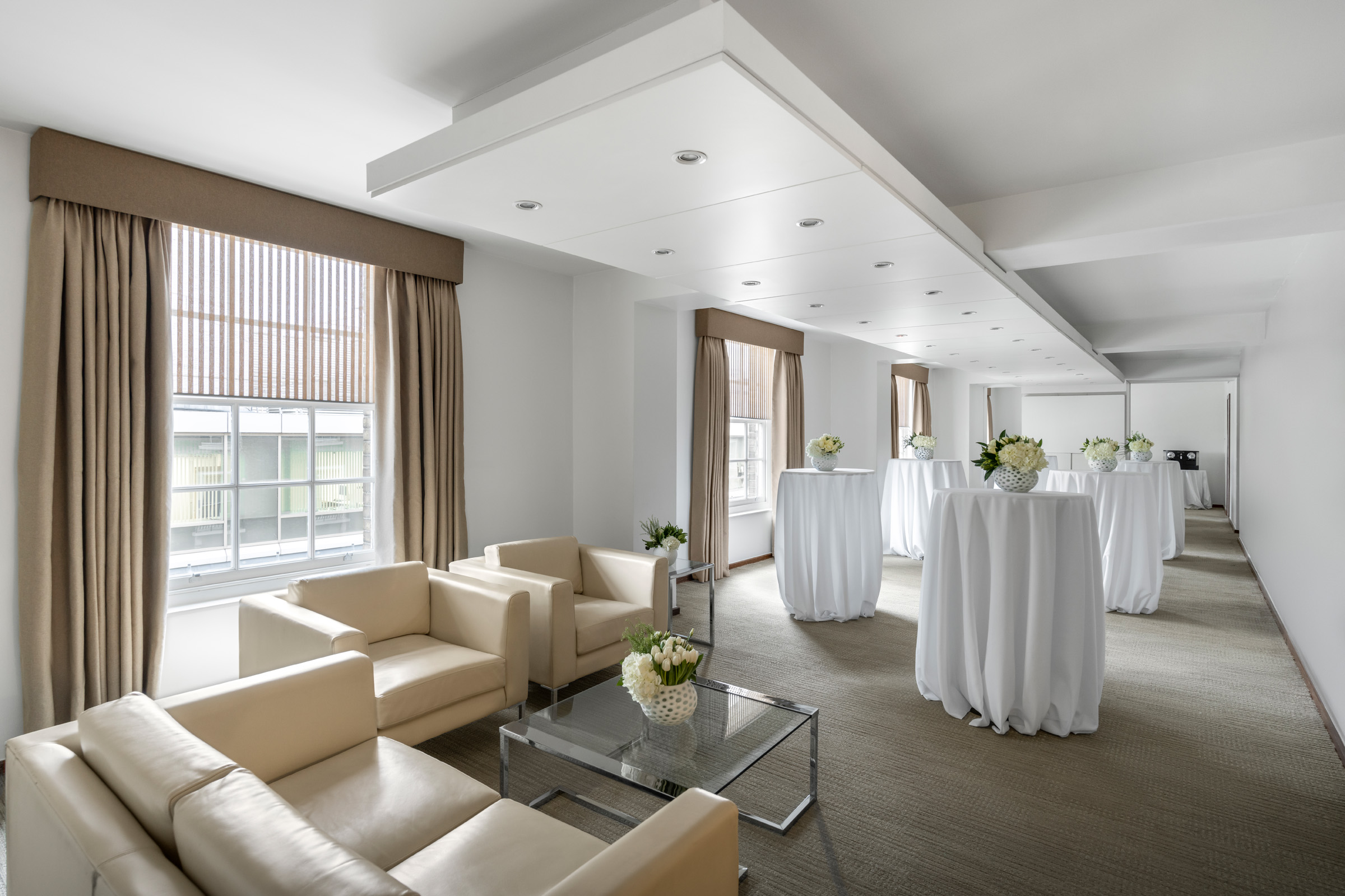 Modern event space at COMO Metropolitan London, perfect for networking and receptions.