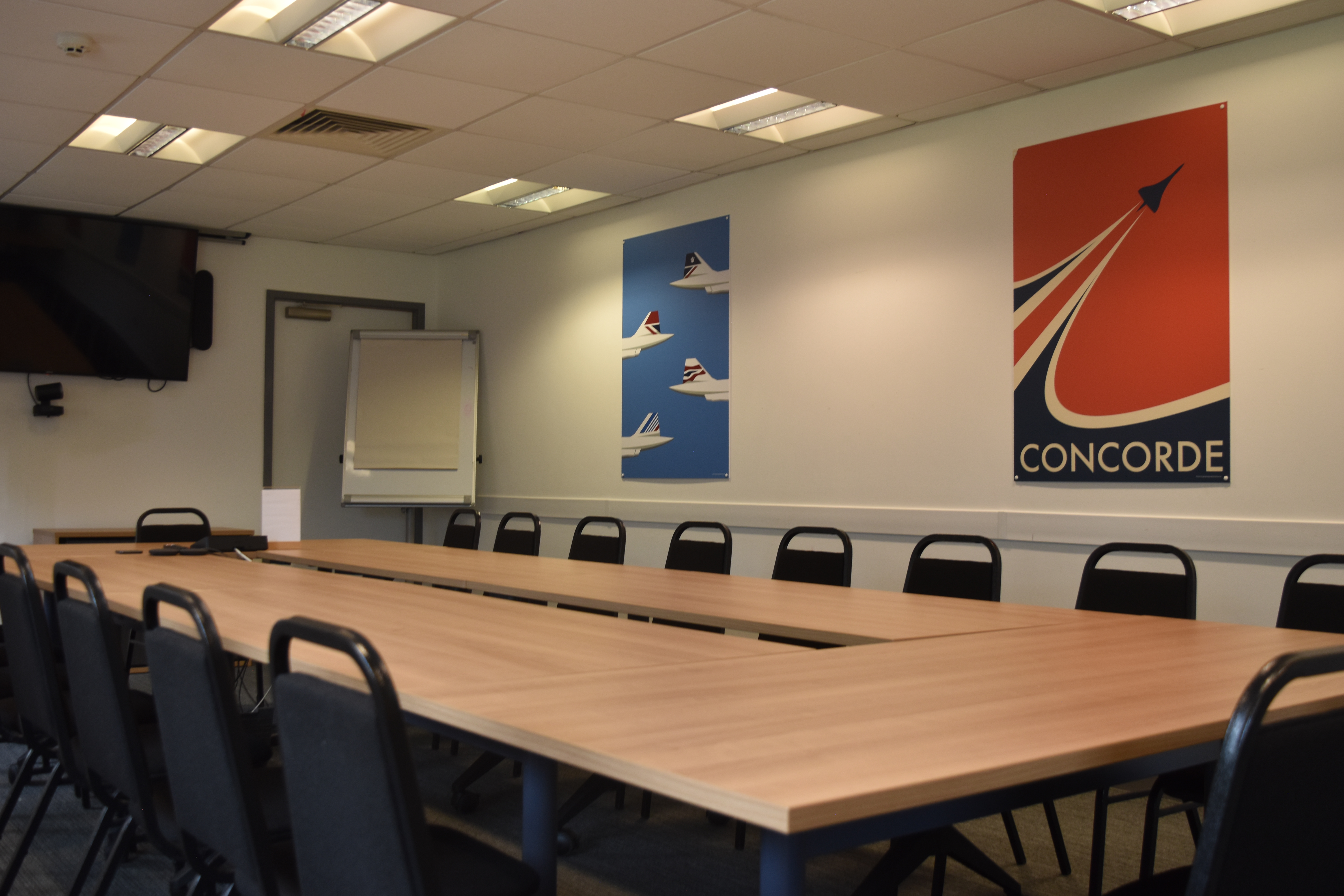 Alpha Charlie Suite meeting room with modern decor, ideal for professional gatherings and presentations.