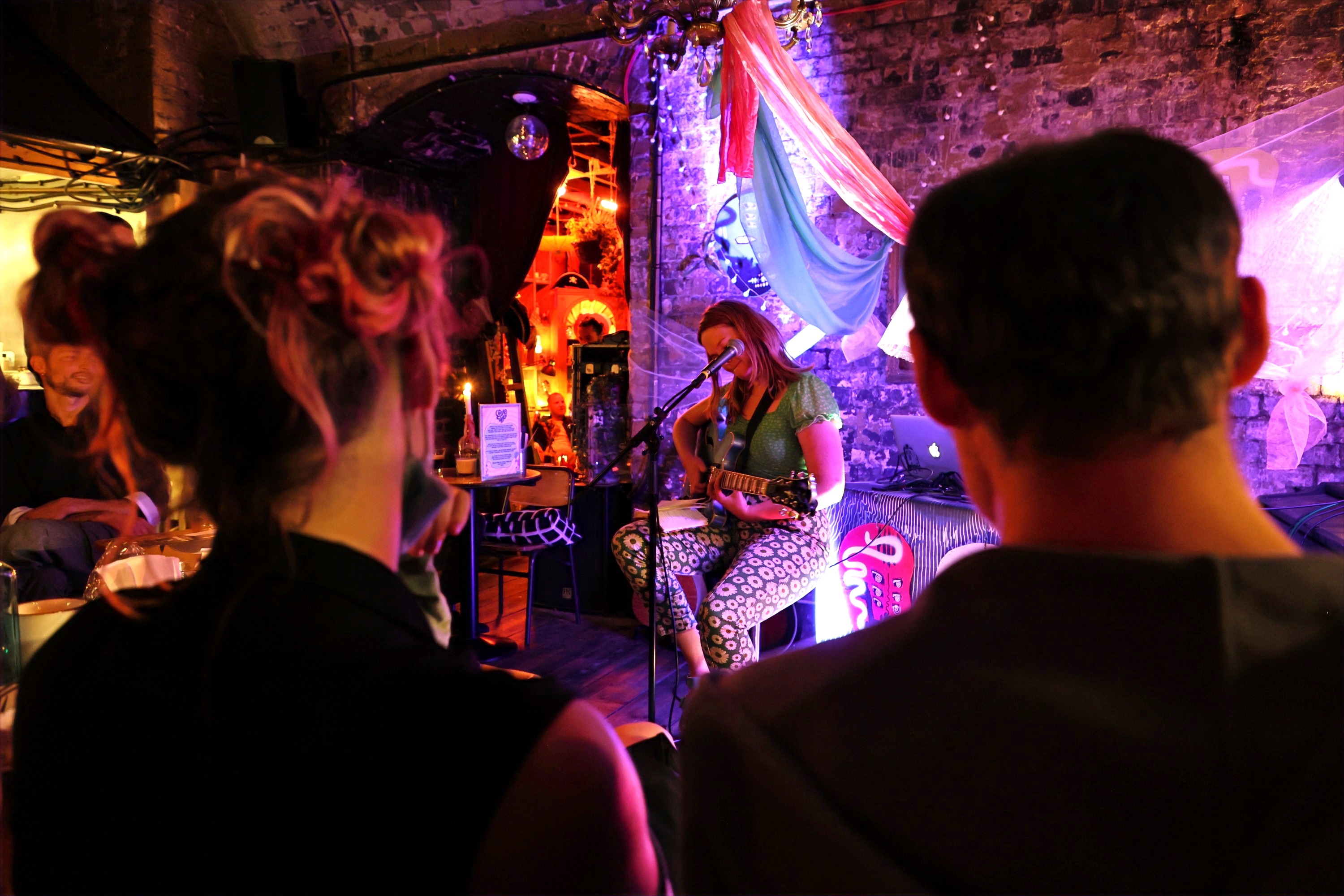 Intimate live performance at Loveshack with warm lighting, perfect for events and networking.