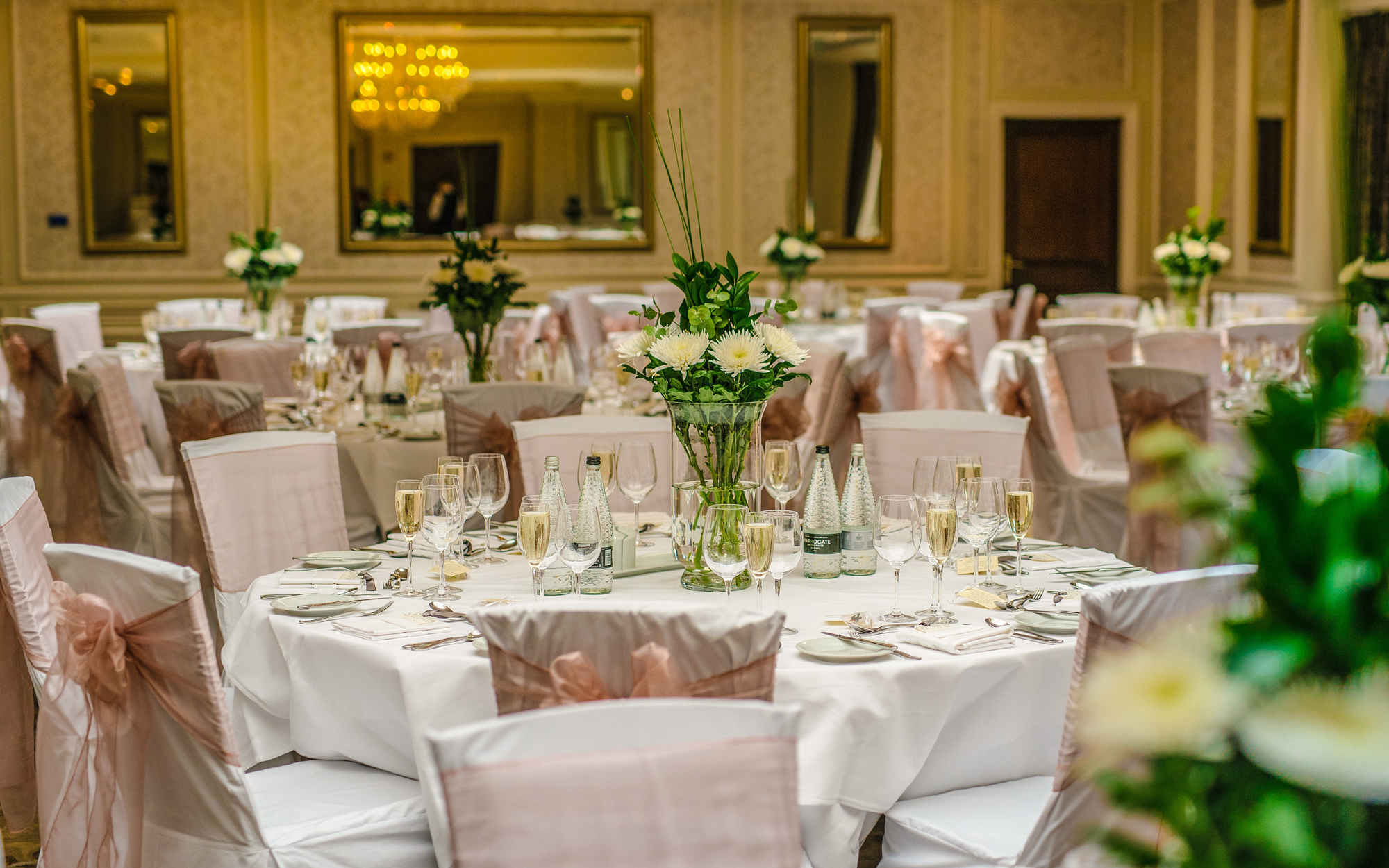 Elegant Rockliffe Suite banquet hall with white linens, perfect for weddings and corporate events.