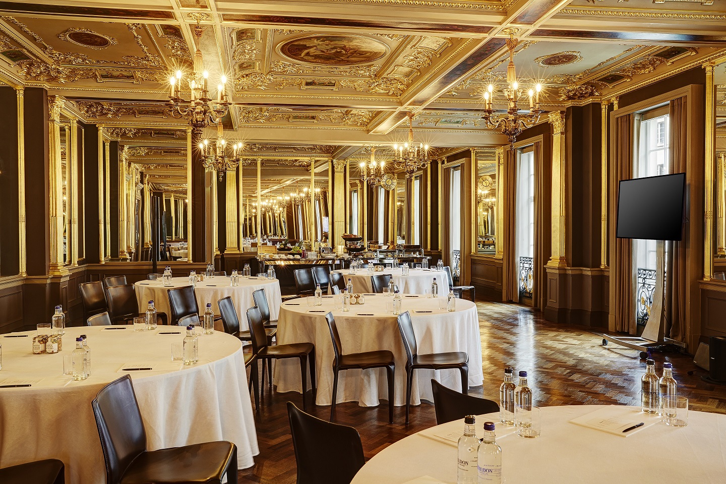 Elegant Pompadour Ballroom with chandeliers, perfect for corporate meetings and galas.