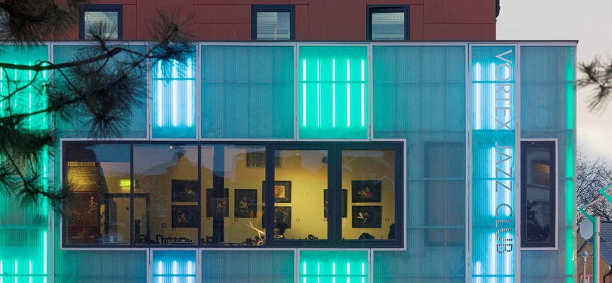 Modern Vortex venue with vibrant neon lighting, perfect for events and gatherings.