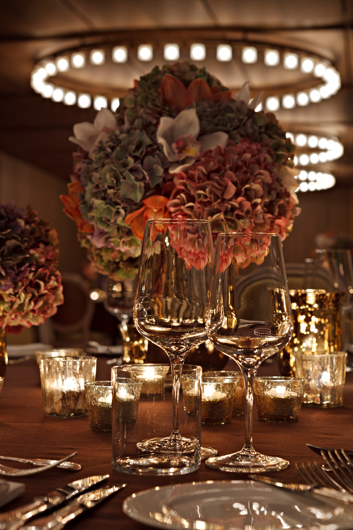 Elegant table with floral centerpieces at Queensberry, Hotel Cafe Royal for upscale events.