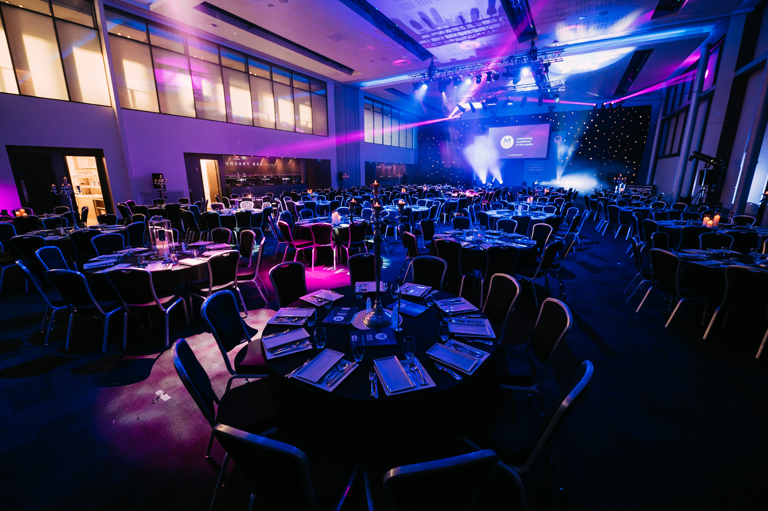 Elegant event space at The Point, Emirates Old Trafford, set for conferences and gala dinners.