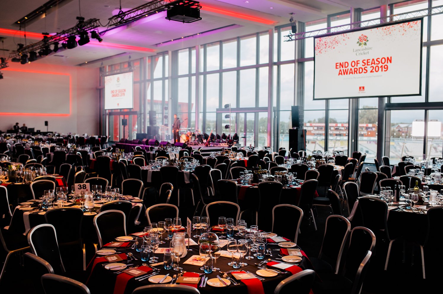 Elegant awards ceremony setup at The Point, Emirates Old Trafford with fine dining tables.