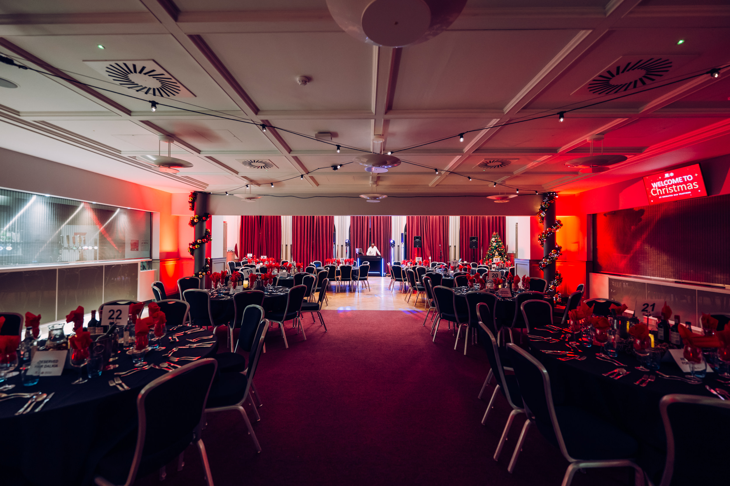 Elegant Members Suite at Emirates Old Trafford, set for a formal dinner event.