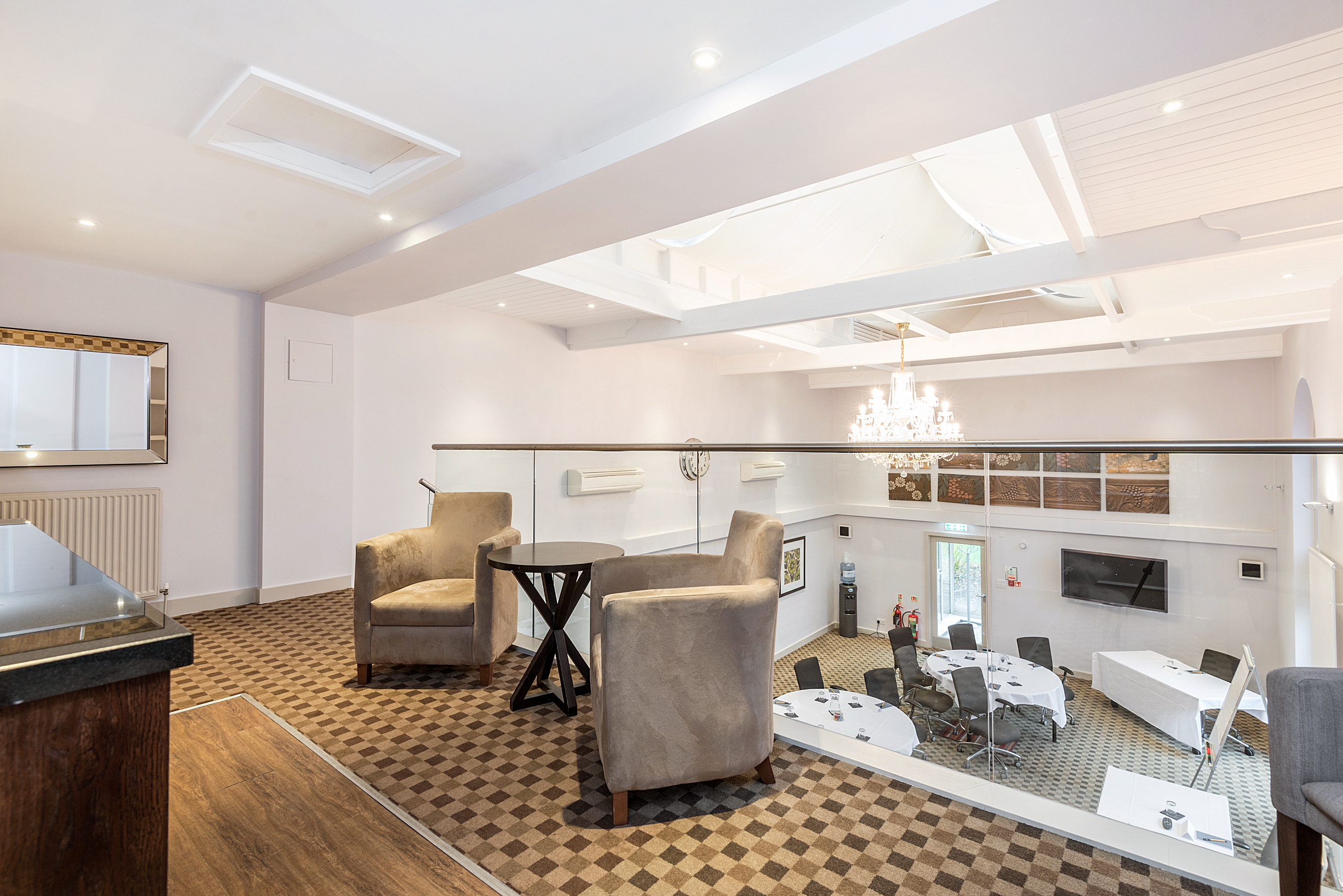 Versatile meeting space at New Place Hotel, Hampshire with modern furnishings for corporate events.