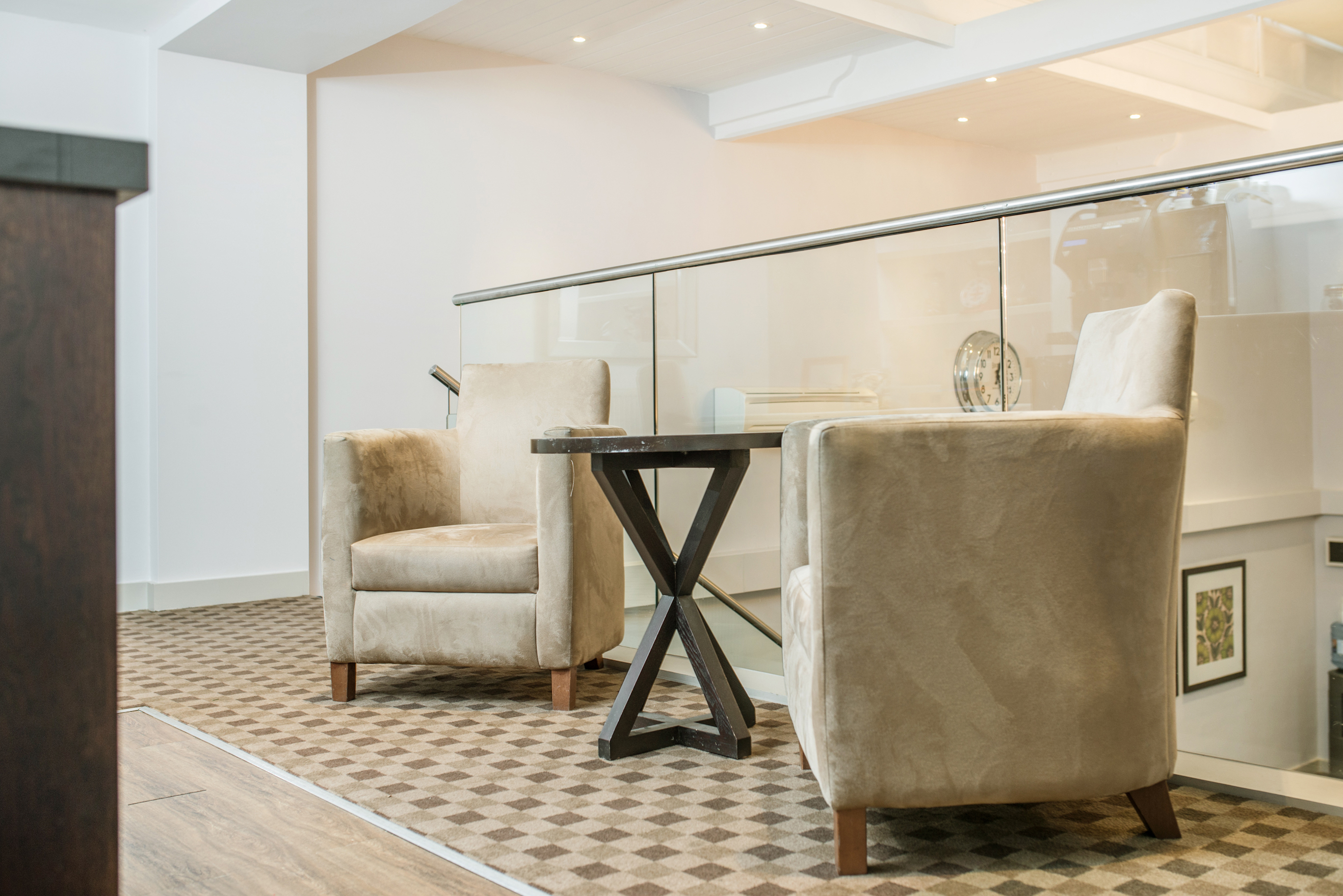 Stylish seating area in The Court, New Place Hotel, perfect for networking events.