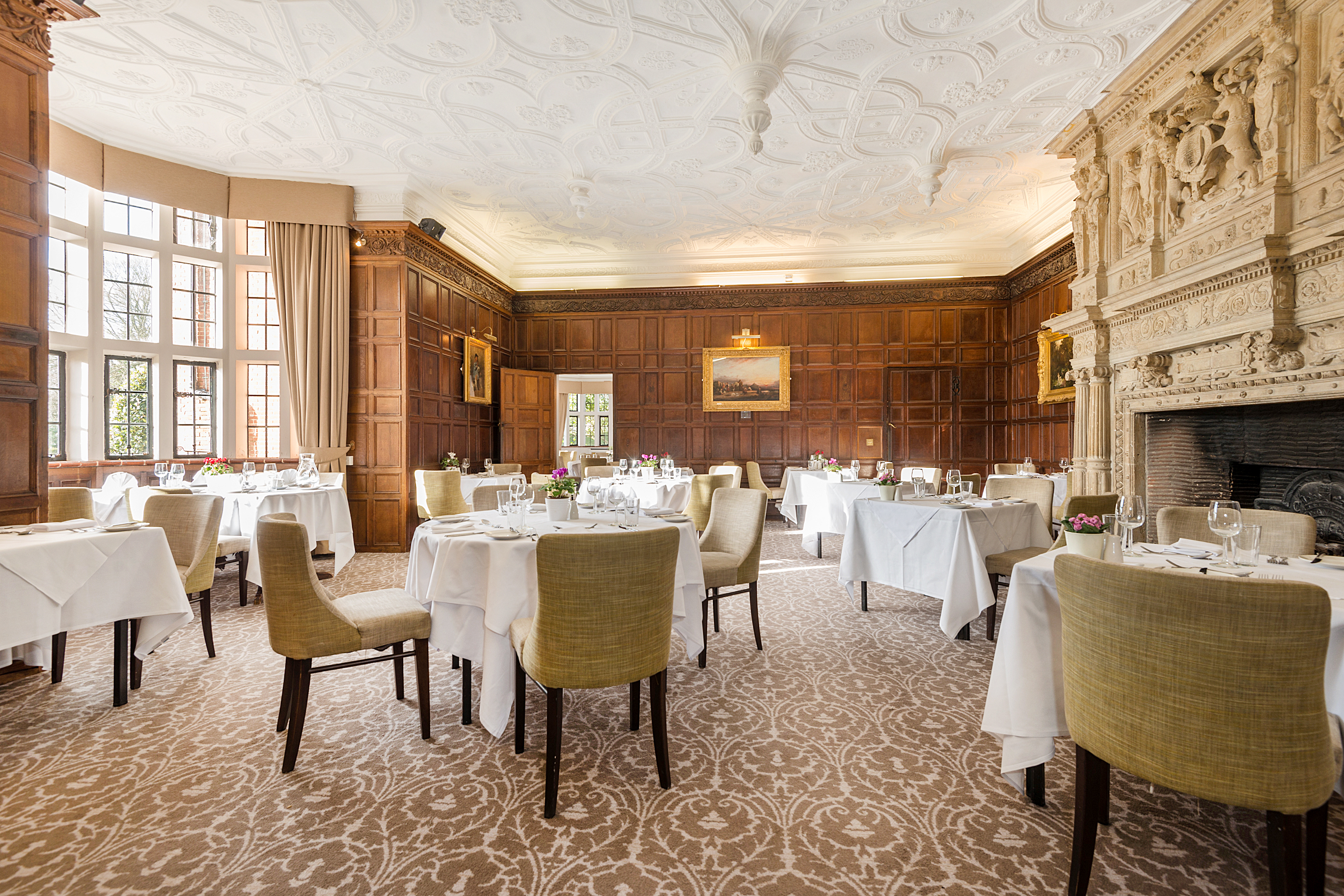 Elegant dining room at New Place Hotel, Hampshire, ideal for formal events and gatherings.