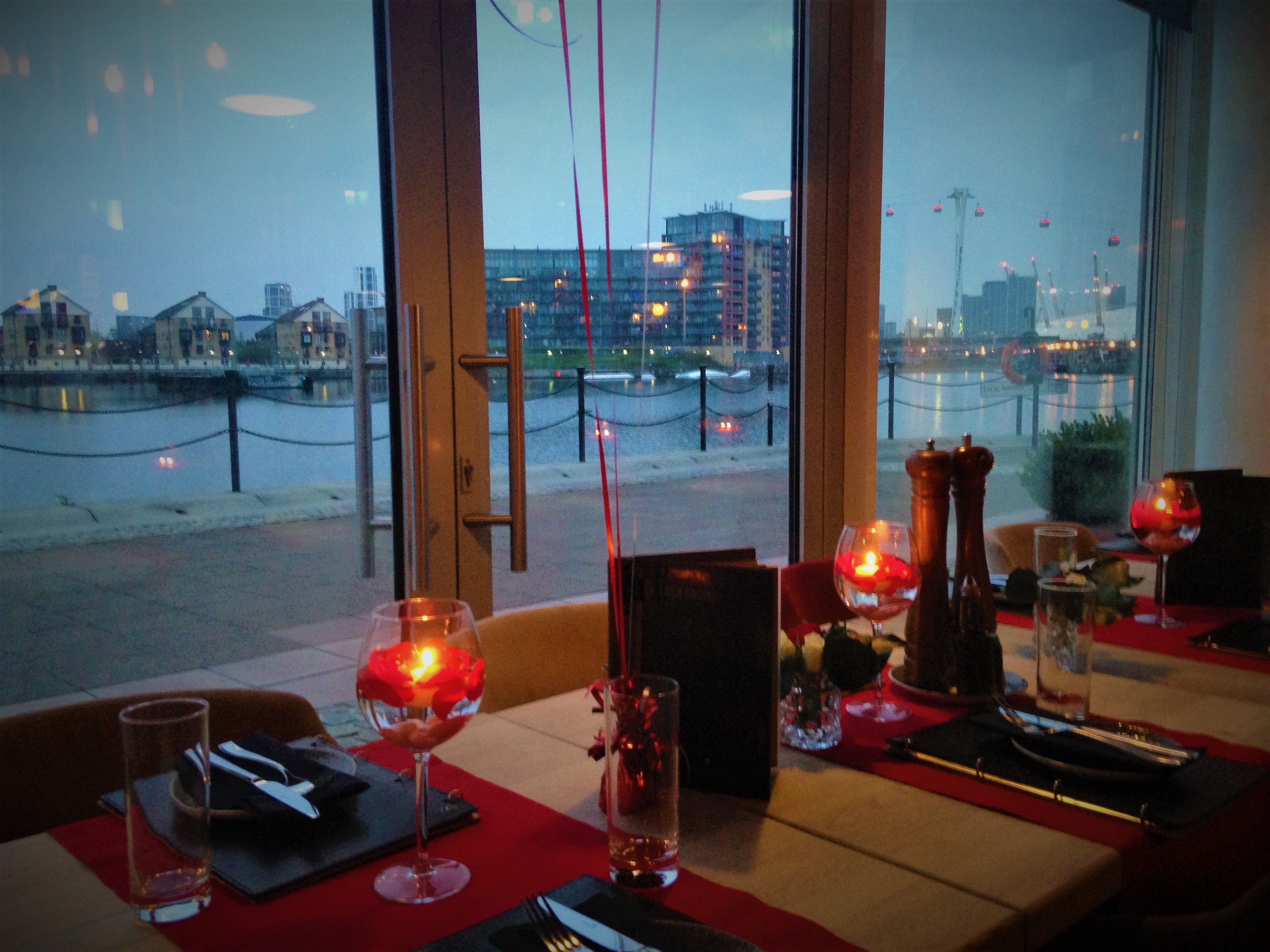 Elegant dining table with glassware at Top 1 Forever Restaurant, ideal for upscale events.