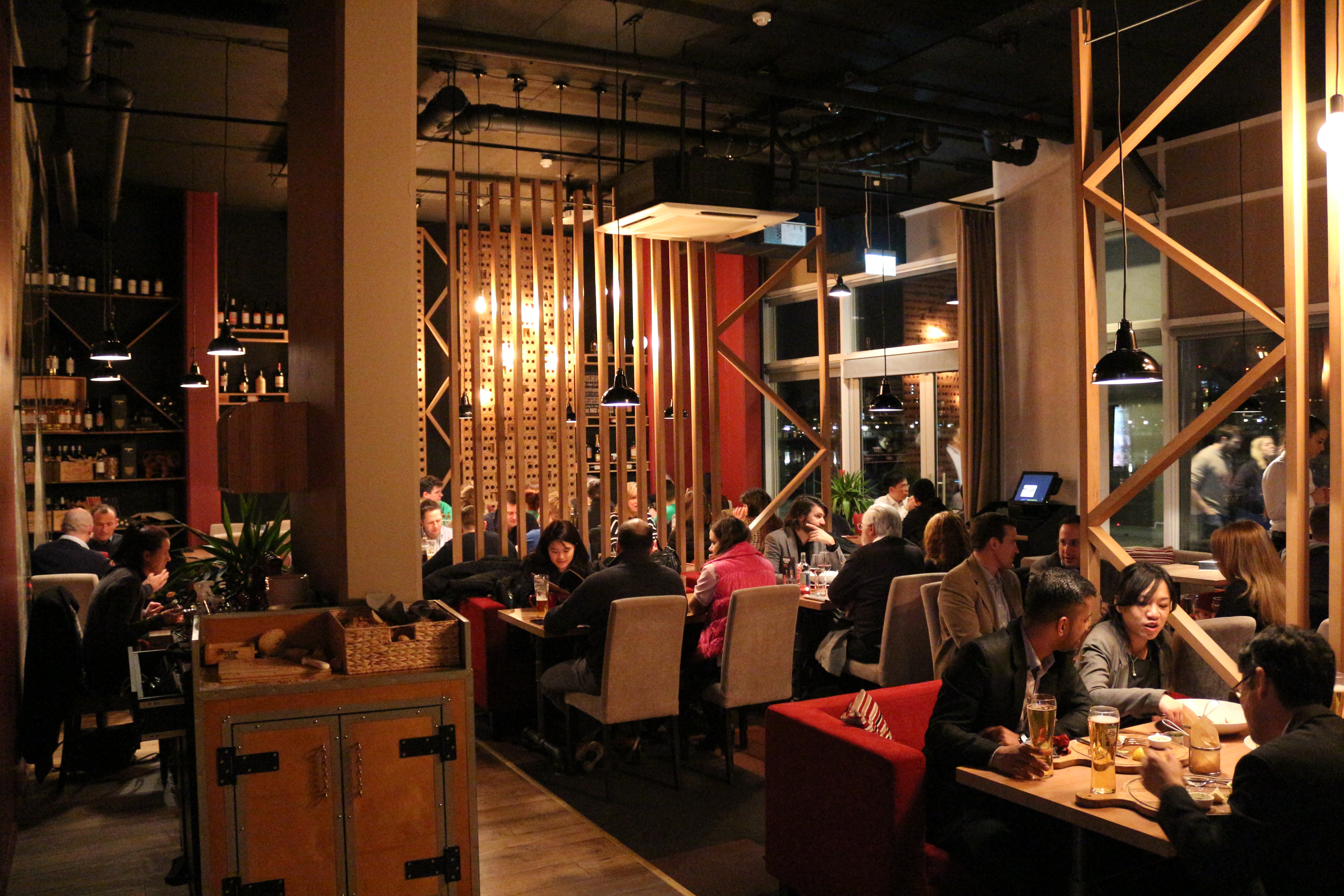 Vibrant restaurant interior with warm lighting for intimate gatherings and networking events.