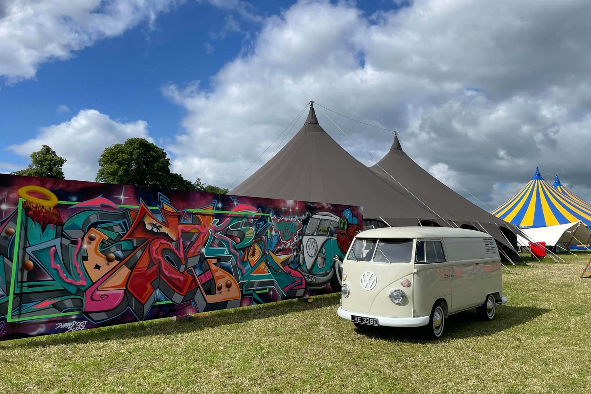 Vibrant Ashley Showground with classic VW van, ideal for festivals and gatherings.