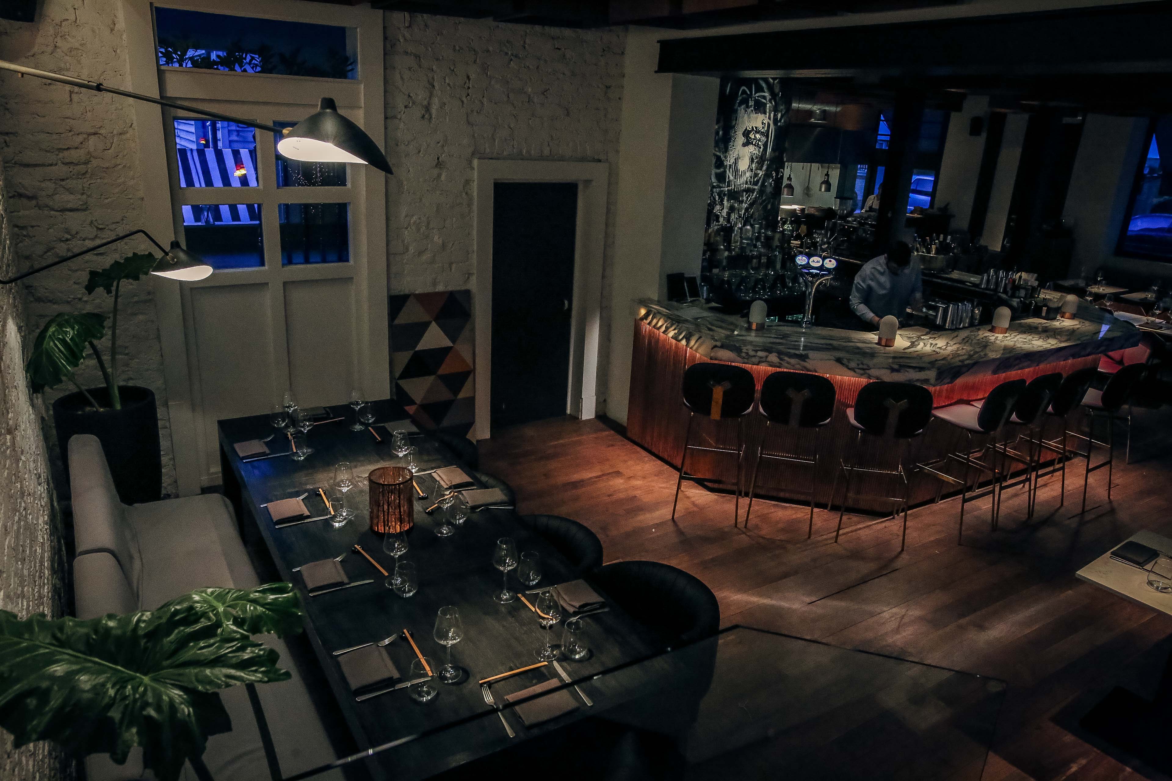 Ground Floor Restaurant: stylish dining space for private events, sushi bar, warm lighting.