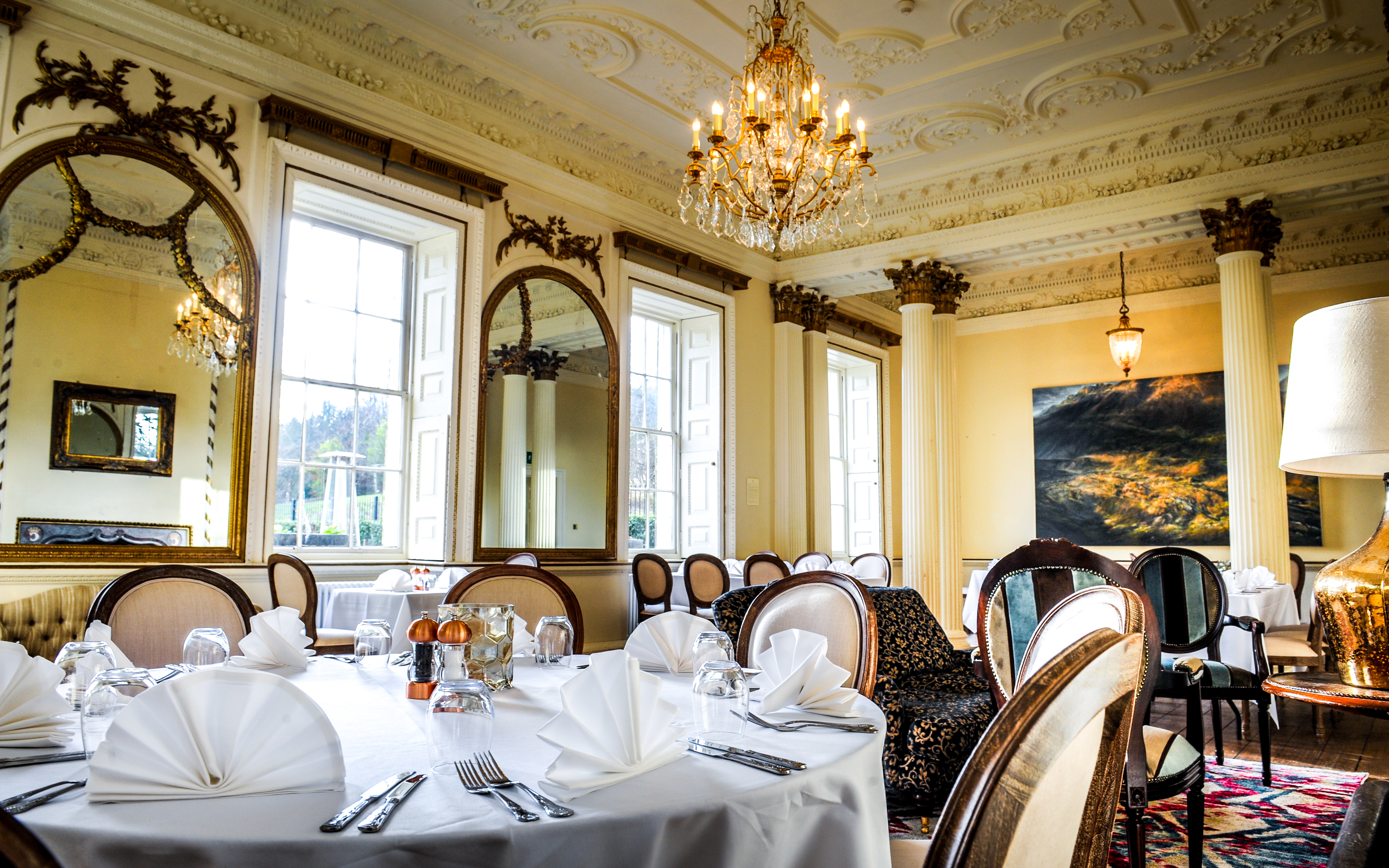 Elegant dining room with chandelier, perfect for upscale events and formal dinners.