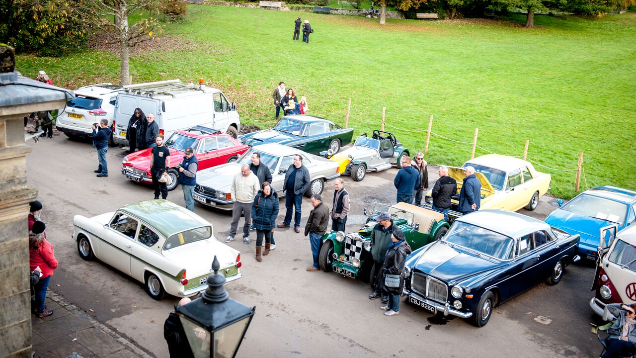 Garden marquee event with classic cars, perfect for networking and gatherings.