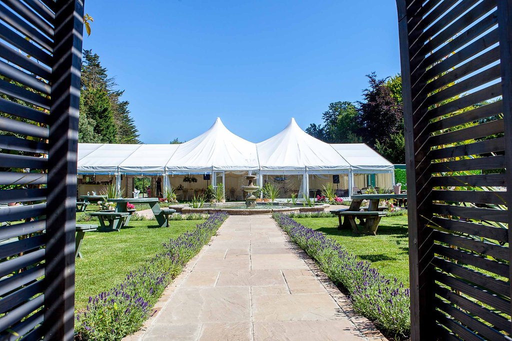 Outdoor event space at Proud Country House with marquee tent, perfect for weddings and parties.