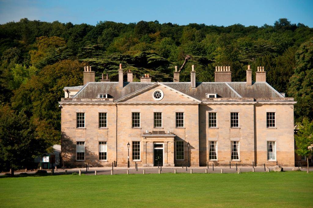 Elegant venue at Proud Country House with lush greenery for events and meetings.