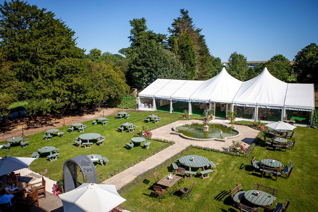 Outdoor event venue at Proud Country House with marquee, ideal for weddings and retreats.