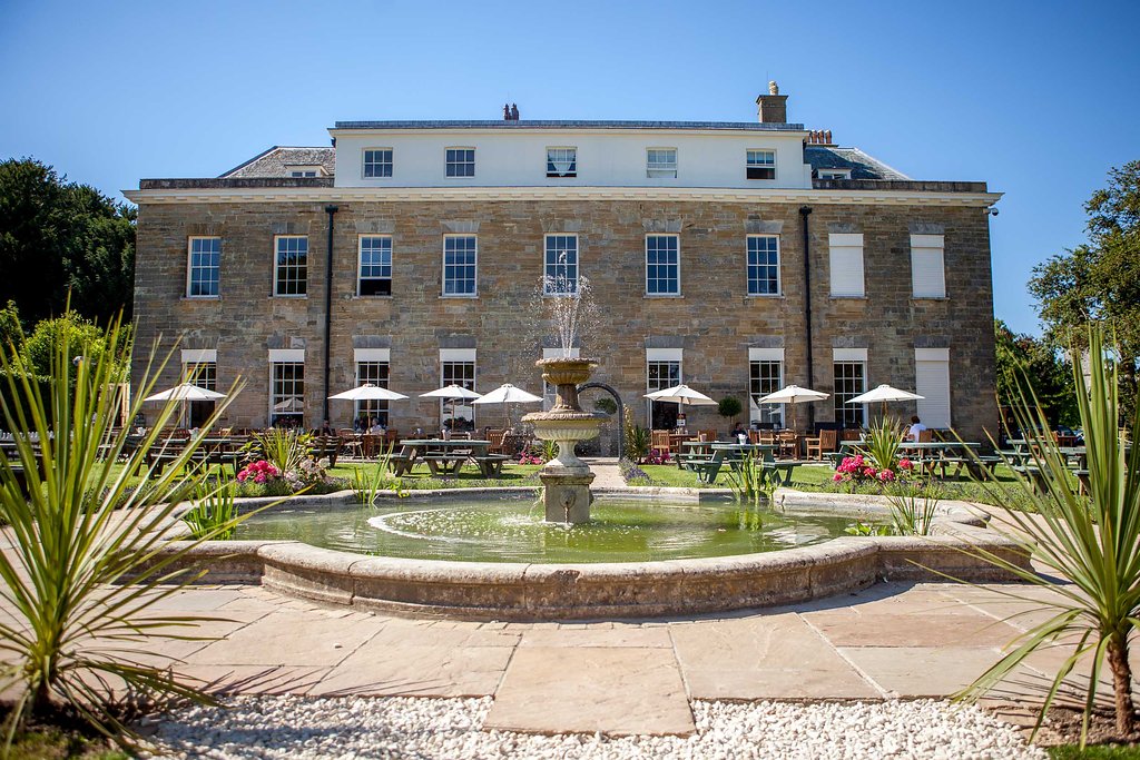 Stunning outdoor venue at Proud Country House with elegant stone architecture and gardens.