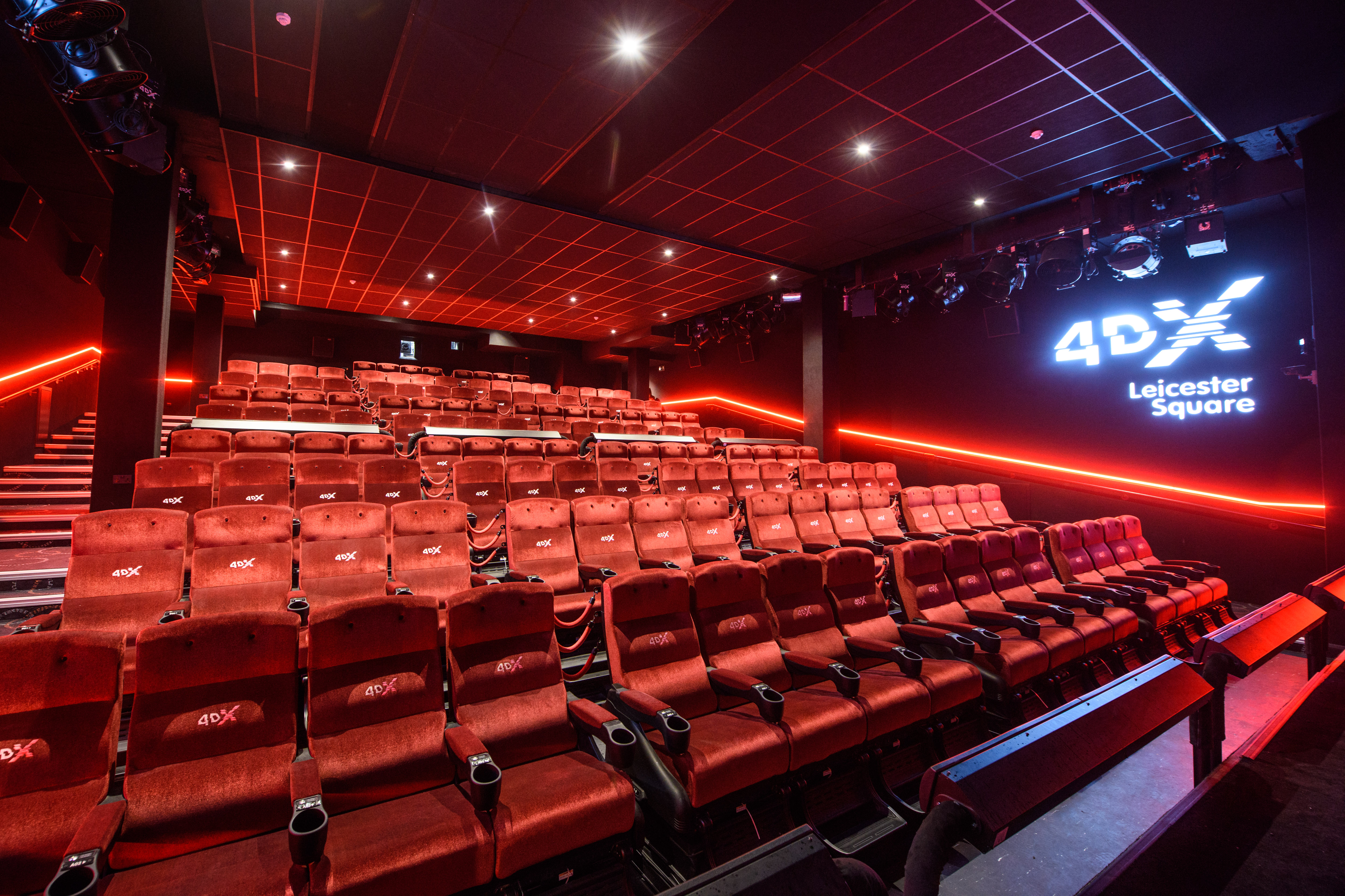 4DX cinema auditorium with plush red seating for immersive film screenings and events.